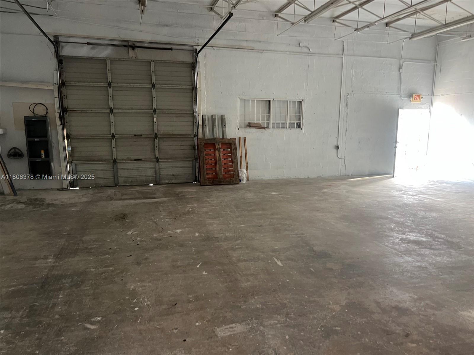 Great opportunity! Discover an exceptional industrial space in the heart of the vibrant Leah Arts District. The warehouse is equipped with a roll-up door. This 1,200-square-foot warehouse features high ceilings and an open-concept layout, with three entrances that provide flexible access and functionality. It is designed for efficiency and convenience and is suitable for storage, distribution, or light manufacturing. The expansive floor plan has a high clearance, allowing for tall racking or equipment. Durable concrete flooring and steel structure make it ideal for heavy-duty use. The property also includes one private bathroom and an outdoor storage area for additional space. The building is in the heart of Hialeah, directly across from the famous shopping center, Flamingo Plaza.
