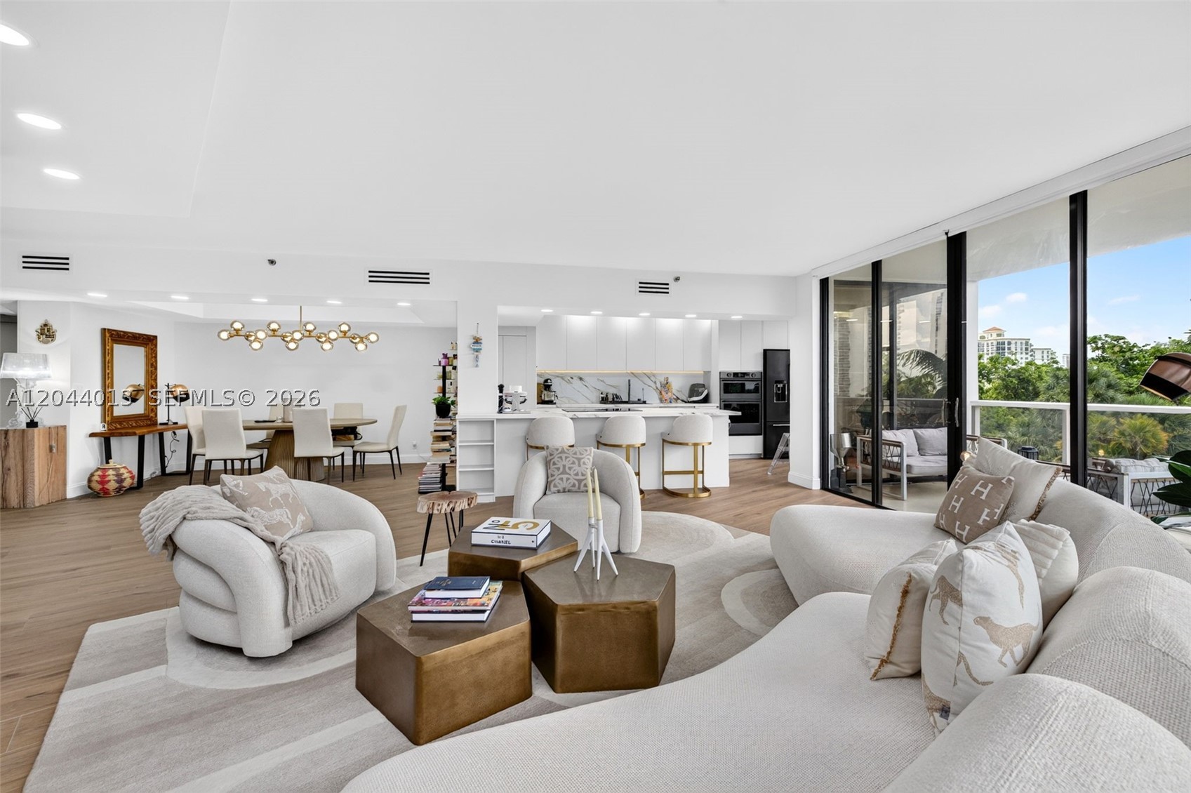 New, New, New! Perfection In A 3 Bedroom Modern Contemporary High End Residence. This Truly Reimagined Designer Home In The Hamptons Is Far More Than A Renovation, It's A Complete Architectural Transformation. Meticulously Crafted With Uncompromising Attention To Detail And The Finest Materials Sourced From Around The World. Over 1/2 Million $ Spent! Finest Finishes Include: Italian Designed Open Chef's Kitchen With Italian Porcelain Countertops And Oversized Island, Top Of The Line Appliances, Smart Home Technology With Motorized Shades, Lighting, And Comfort At The Touch Of A Button, Porcelain Floors Throughout, Custom Doors, Custom Lighting, Custom Closets, And So Much More. The Expansive Primary Suite Offers A Spacious Closet And Spa Inspired Bathroom With High Quality Finishes. Enjoy The Huge Wrap Around Terrace, Perfect For Entertaining! Your Dream Home Is No Longer A Vision, It Is Here!  Experience The 5-star Hamptons Lifestyle With Resort Style Amenities: Pool With Huge Deck & Bbq Area, Gym/SPA, Media Rm, Library, Event Room, Enter Club House To The Hamptons Restaurant, Second Pool On The Intracoastal, New Gym, SPA, Sauna, Nail Salon, Racquetball & Tennis Courts, Kids Room, Card Rm, Room Service, Full Movie Theater, Also Cafe With Outdoor Seating! Close To Aventura Mall, Restaurants, Casinos, 5 Min To Beach, Near 2 Int'l Airports. Next To Soffer Exercise Trail On Golf Course.