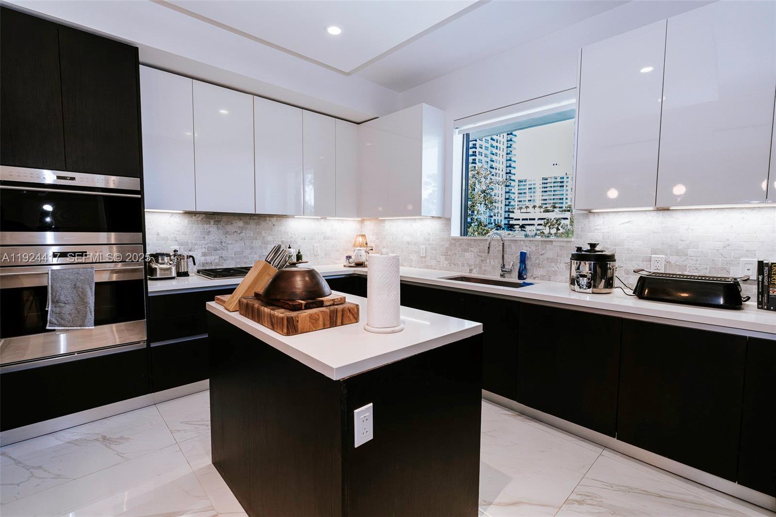 Live steps from Fort Lauderdale Beach in this 3 bedroom 3.5 bath furnished townhouse style condo offering over 2,300 square feet of modern elegance. The open kitchen features Italian cabinetry, quartz countertops, and Sub Zero Wolf appliances, flowing into a designer styled living space with floor to ceiling glass. A private outdoor terrace with summer kitchen invites seamless indoor outdoor living. Upstairs each ensuite bedroom includes a balcony, while the primary suite offers dual walk in closets and a spa inspired bath. With direct elevator entry, two secure parking spaces, and access to resort amenities including clubhouse, pool, fitness center, spa, and sauna, this home delivers comfort and convenience in a boutique coastal community. Offered fully furnished.