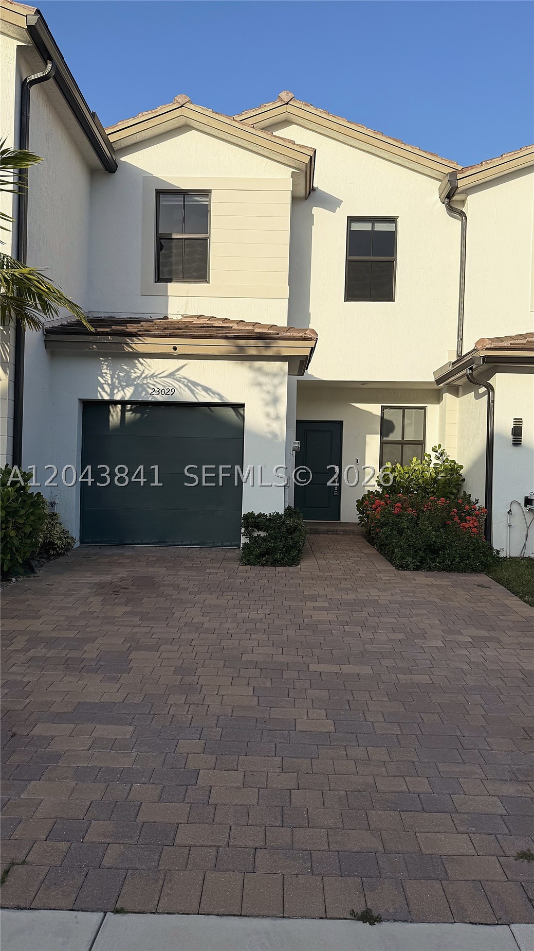 Better than new 2023 townhouse in the heart of Kendall. This bright, open concept home offers soaring high ceilings and a modern kitchen with quartz countertops, wood cabinetry, and stainless steel appliances including refrigerator and dishwasher. Step out to a brand new covered terrace with LED lighting, perfect for relaxing and entertaining. All three bedrooms are upstairs, including a spacious primary suite with its own private bathroom, plus a second full bath for the additional bedrooms. A second floor laundry with washer and dryer adds everyday convenience. A 1-car garage with driveway parking, high-impact windows and doors, and a private fenced patio complete the home. Enjoy Siena Reserve's community pool and low monthly HOA, minutes from US-1, Black Point Marina, shopping, dining, and schools. Move-in ready in a fast growing area, close to major roadways. A must see - easy to show!