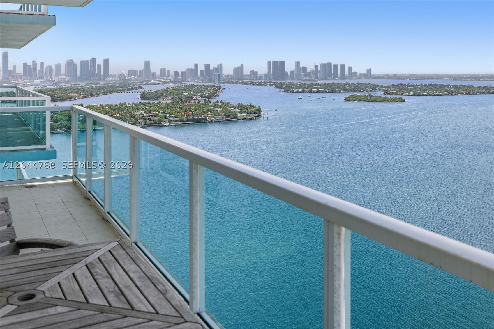 Rarely available corner residence with an oversized wraparound terrace showcasing breathtaking views of the South Beach skyline, the Atlantic Ocean, and spectacular sunrises. The expansive terrace extends beyond the living area and features direct access from the primary suite through floor-to-ceiling glass, creating an exceptional indoor-outdoor living experience. The open kitchen offers granite countertops, stainless steel appliances, and a breakfast bar overlooking the spacious living and dining areas. The split-bedroom floor plan provides privacy, while the primary suite features custom walk-in closet built-ins and direct terrace access. Residents of The Floridian enjoy resort-style amenities including two bayfront pools, a state-of-the-art fitness center, tennis court, hot tub, sauna, convenience store, salon, business center, 24-hour concierge, valet, and security. Ideally located across from Canopy Park and just moments from South of Fifth, Sunset Harbour, Lincoln Road, and the MacArthur Causeway, offering effortless access to Miami's best dining, shopping, entertainment, and the beach.