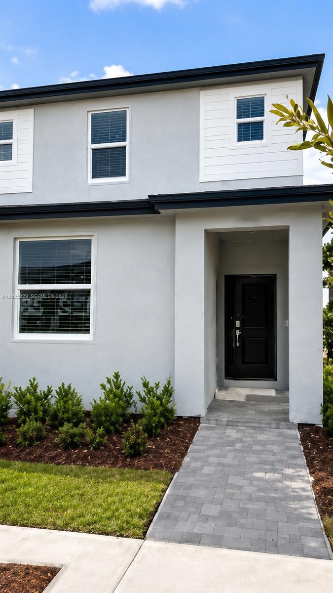 Brand-new townhome featuring a smart and functional layout with 3 bedrooms and 3 full bathrooms. One bedroom and full bath are conveniently located on the first floor—perfect for guests, in-laws, or a private office. Upstairs, two spacious en-suite bedrooms each offer their own private bathrooms, providing comfort and privacy. The main living area is bright and open, with a seamless flow into a modern kitchen equipped with sleek cabinetry, stainless steel appliances, and a center island ideal for everyday living and entertaining. Sliding doors lead to a private fenced patio, creating a comfortable outdoor space to relax or host. Located in a well-maintained community with amenities including a clubhouse, pool, and playground. Easy access to major highways, shopping, dining, and outdoor destinations. Move-in ready and designed for modern living.