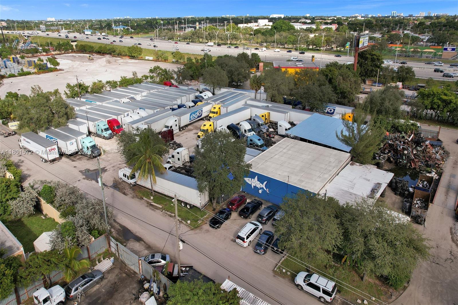 Exclusively presented by LX Realty, a large 1.5-acre industrial lot, featuring a 3,000 square foot warehouse with ample space for truck/heavy machinery parking and storage. The property also features an office space, along with additional space for parking out front. Conveniently located right next to I-95.