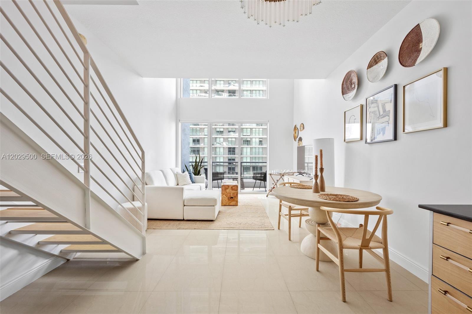 Perched on the 34th floor in the sought-after Infinity at Brickell, this beautifully maintained two-story residence offers a sophisticated blend of style, comfort, and convenience. Filled with natural light, the spacious interior features soaring volume ceilings, ceramic tile flooring throughout, built-in cabinetry, a generous walk-in closet, and a functional split-level layout that creates a unique sense of space. A private balcony captures bay views and the vibrant Brickell skyline. Offered in impeccable, move-in-ready condition, the seller is open to selling the residence fully furnished. An excellent investment opportunity, the building allows flexible rental options and ownership flexibility. Residents enjoy a full-service lifestyle with 24-hour security, attended lobby, assigned parking, valet service, and guest parking. Resort-style amenities include a waterfront pool, fitness center, business center, billiards and media rooms, barbecue and outdoor entertaining areas, covered garage, and doorman services. Ideally located in the heart of Brickell with easy access to major highways, dining, shopping, and entertainment while positioned away from the area's busiest congestion. Pet-friendly community.
