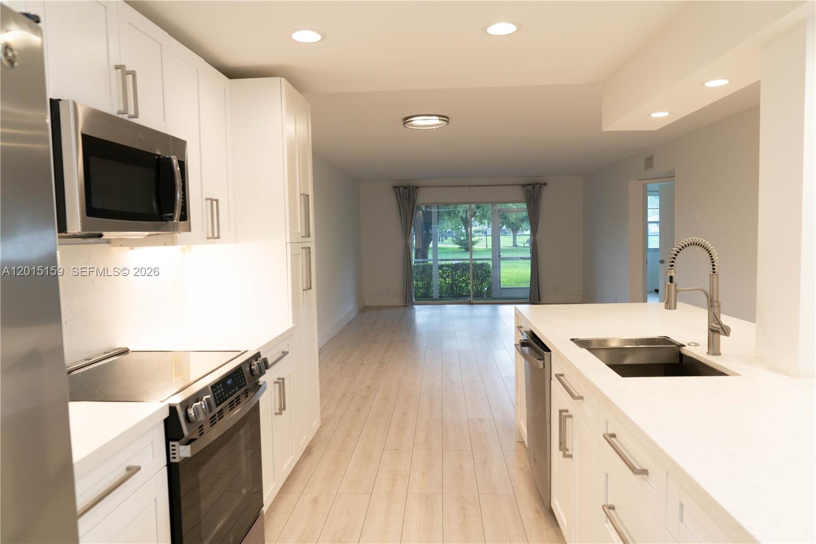 Beautiful apartment with 2 bedrooms 2 bathrooms located in the desirable community of Wynmoor 55+ community  at Coconut Creek first floor, total remodeled, upgrade kitchen, stainless steel appliances, granite countertops and central air conditioning relocated, unit offers a relaxing pool view and access to outstanding resort-style, amenities including an Olympic-size pool, jacuzzi have washer and dryer inside, fitness center, tennis courts, golf course, movie theater, clubhouse, barbecue area, car wash and variety of social  activities. Gated community with 24-hrs guarded entrance for added security and peace of mind. Enjoy activities and vibrant lifestyle with many amenities and entertainment options every day. text listing agent and showing request.