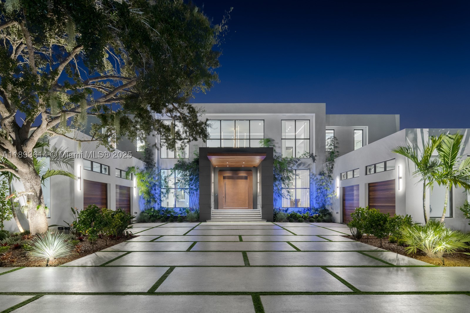 A statement of modern architecture & artistry, this 2025 estate reimagines luxury living on over an acre of resort-caliber grounds. Spanning 12,000+ sq ft, including a 1,000 sq ft guest home, every inch reflects uncompromising design & craftsmanship. Soaring 28 ft ceilings, custom murals, a floating glass staircase, private elevator, & showpiece fireplace define its elegance & scale. The chef’s kitchen, Lutron automation, & full smart-home integration blend innovation with comfort. 14 ft high garage bays fit multiple lifts. The primary wing unveils a private terrace & custom closets. Outdoors rival a five-star resort with a full summer kitchen, covered pavilions, poolside lounge, & expansive grounds ideal for courts or gardens. A true jewel—extraordinary, extravagant, & undeniably refined.