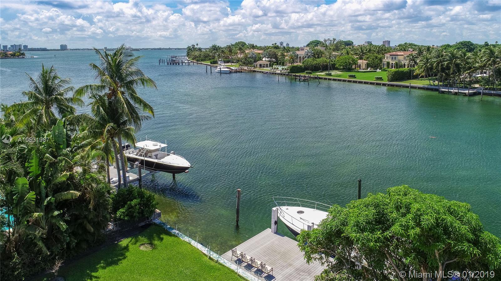 First time on the market! A large, 6,954-sf home situated on a double waterfront lot with 19,750-sf of land and 100 feet of waterfront overlooking the serene water and the lush Indian Creek Village. This is the perfect renovation project! Situated on the large lot is a 1957 home with 4 bedrooms and 4.5 baths, including a huge master suite with an office, large living room with an entertainment bar, and a kitchen with a family room. The property has a 2-car garage, a circular driveway, a new pool with a spa, and a large dock. Renovate the existing home or build your new home on this premier lot on Biscaya Drive in Surfside, and nearby the Bal Harbour shops.