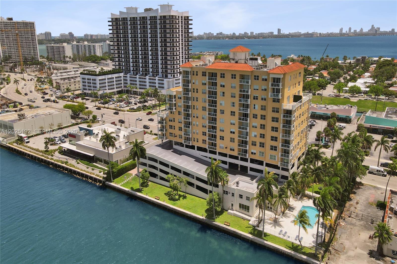 Bright & spacious condo in the heart of North Bay Village! This 2 beds / 2 baths residence offers 984 sqft on the 12th floor with stunning views of Biscayne Bay, the Miami skyline, and breathtaking sunsets. Bright and open layout featuring impact balcony doors, wood flooring throughout with carpet in the bedrooms, and a kitchen with white appliances overlooking the bay. Washer/Dryer in the unit! Rare opportunity with two assigned covered parking spaces plus a private storage unit. Enjoy resort-style amenities including bayfront pool, gym, BBQ/picnic area, community room, elevator, and 24/7 security. FULLY FUNDED building with no upcoming assessments. Rentals allowed immediately after purchase with a minimum 1-year lease.