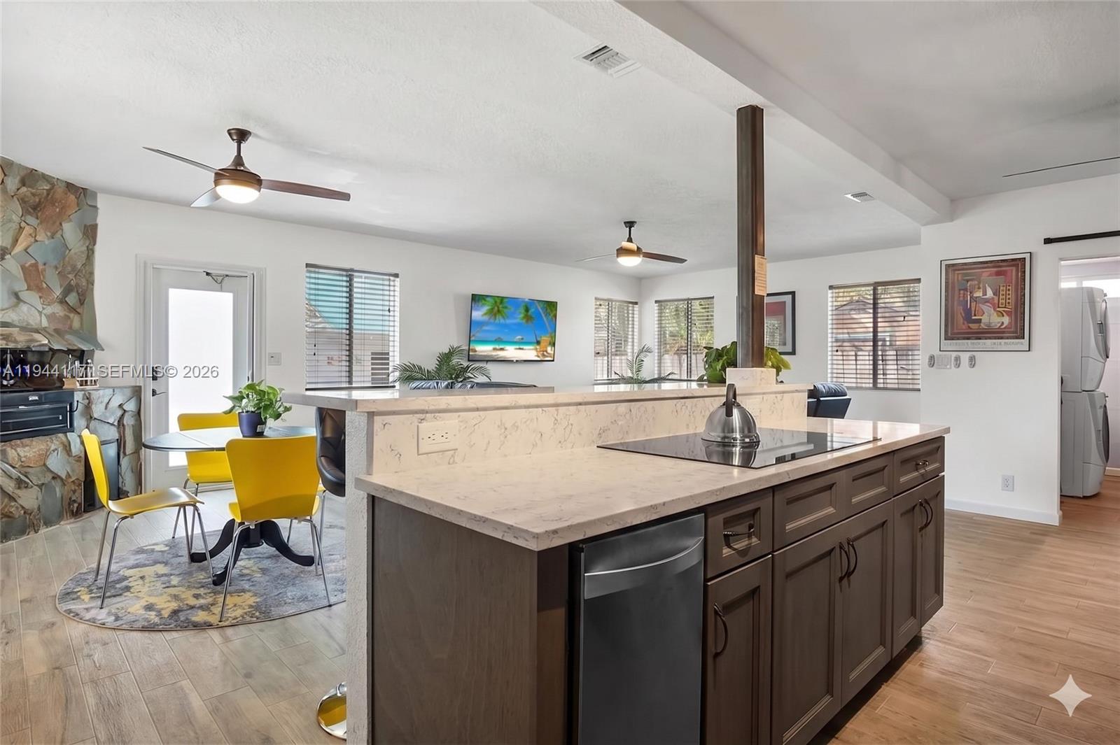 Fully Permitted and freshly painted, Move-In Ready, Wilton Manors West. Completely remodeled in 2019 with over $100,000 in upgrades, this 3-bed, 3-bat home offers true turnkey living. The property features impact windows and doors, tile flooring throughout, and a custom chef’s kitchen with an island cooktop, double ovens, and an under-counter ice maker. The open-concept great room is ideal for entertaining and includes a unique indoor grill with a dedicated vent system. Recent updates include a new A/C, water heater, appliances, and electrical panel. Step outside to a lush, fully fenced backyard with room for a pool, mature avocado and banana trees, a patio, concrete shed, and a multi-zone sprinkler system. The home also offers a circular driveway with carport for convenient parking. Pre-inspected, buy with confidence.
