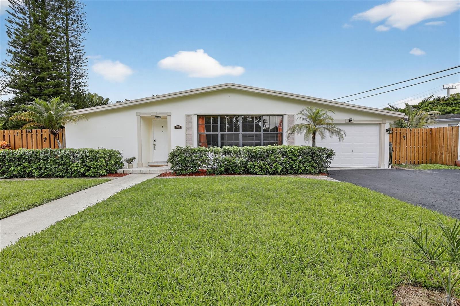 Discover timeless charm in one of Plantation’s most sought-after neighborhoods—Plantation Gardens. This 2-bedroom, 2-bath single-family home offers just over 1,600 sq. ft. of comfortable living on an oversized 10,632 sq. ft lot with plenty of room for extending and enlarging the home. Nestled away in a quiet cul-de-sac, buyers will love the peace of mind that comes with a roof replaced in 2018, upgraded electric, tankless water heater & complete hurricane impact windows & doors, providing lasting security and energy efficiency. The inviting floor plan is filled with natural light and offers plenty of space for both daily living and entertaining. Step outside to enjoy a large yard with endless possibilities. All of this, just moments away from Plantation Walk where you’ll find restaurants, shops, and community events with live music. A rare opportunity to own in this desirable location!