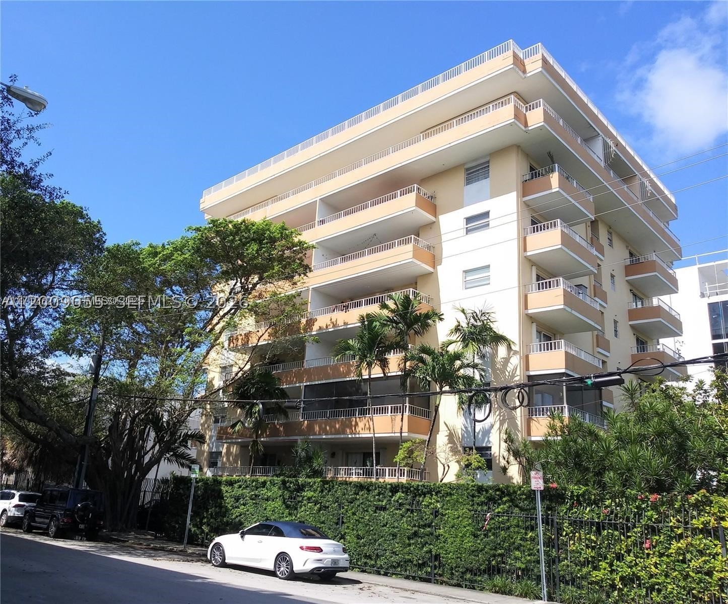 Coconut Grove's lowest price 2 bed-2 bath condo. Park the car, walk to everything. Next to Cocowalk, one block from Coconut Grove Elementary School, and located directly in the heart of the village. Light and bright condo with two very spacious balconies. There is a rooftop deck for entertaining. Owner agrees to pay Special Assessment at closing. The association is in the process of obtaining the 50 year certification.