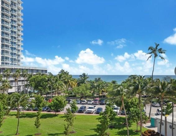 Completely remodeled and fully furnished 1 bedroom + Den & two full baths, with direct ocean views. Enclosed Den can be used as second bedroom. Can be rented Unfurnished. Kitchen has top of the line appliances, bathrooms updated with beautiful tiles and fixtures, impact glass windows & doors. Direct beach access, bicycle path & boardwalk. Walking distance to Publix, Walgreens, banks and cleaners. Amenities include fitness center, heated pool, community/social room, BBQ area. Association payment includes 24hr security, common area maintenance, water/sewer, trash, HVAC A/C system, internet, cable & Wi-Fi. Major infrastructural renovations to the building exterior & HVC systems just completed. Available for year lease, and it's renewable. Call or text Listing Agent for showings.