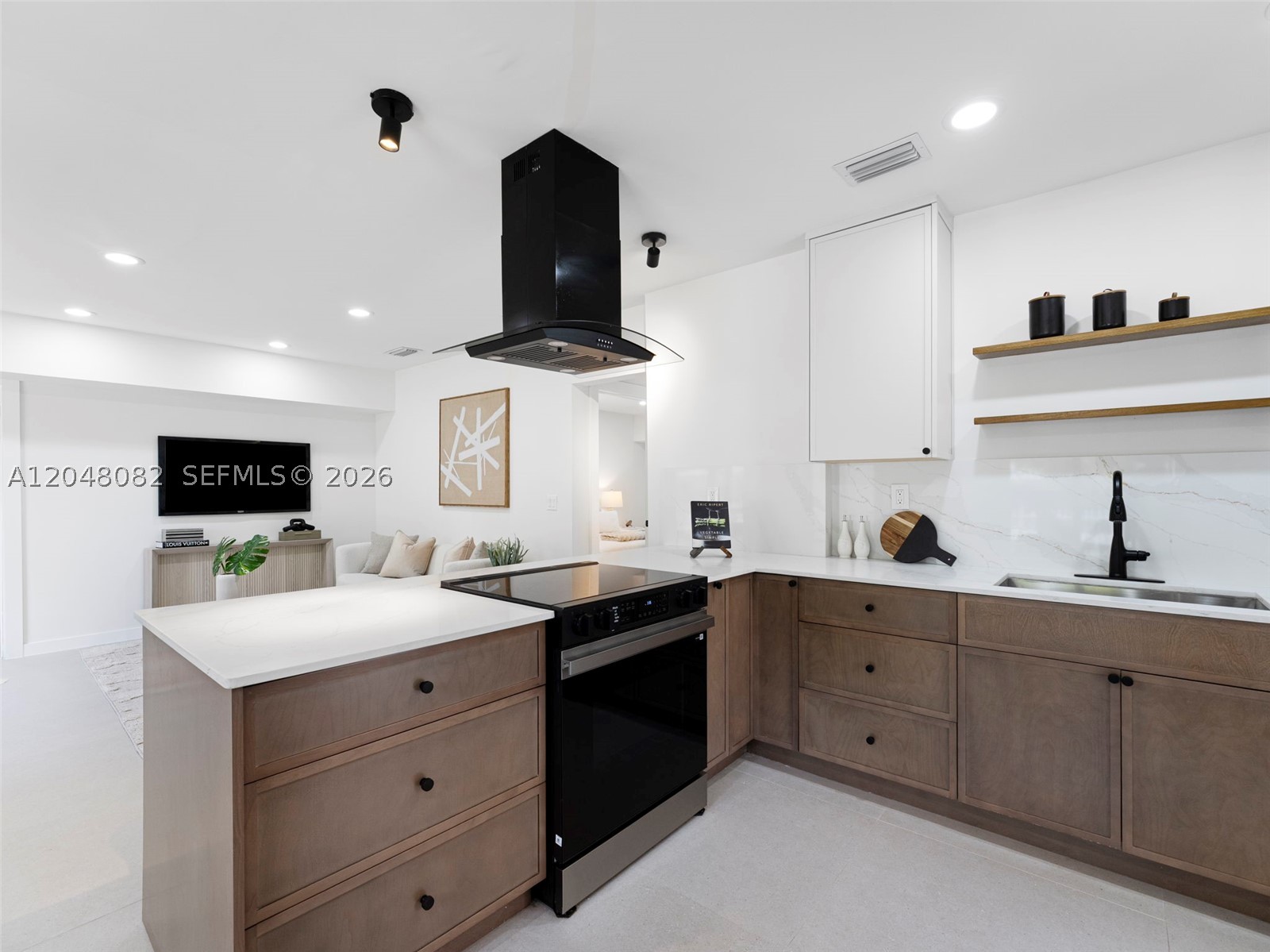 Mid-century modern charm meets contemporary luxury in this beautifully renovated 3BR/2BA home in the highly sought-after River Oaks neighborhood! Just 5 minutes from Las Olas Boulevard and Fort Lauderdale Beach, this move-in-ready residence features a designer chef’s kitchen with a large cooking Quartz island, walnut cabinets, stainless steel appliances, new recessed lighting throughout, fresh interior and exterior paint, a new roof, and impact windows and doors, including a stunning walnut-finished front entry door. The covered carport provides everyday convenience, while the oversized backyard with a pergola is perfect for entertaining, barbecuing, or relaxing outdoors. A versatile extra separate room towards the back offers the ideal space for a home office, gym or recreation room. Newer A/C and recently updated plumbing add to the home’s value and peace of mind. Prime location close to downtown Fort Lauderdale, shopping, dining, parks, marinas, beaches, and major highways. A rare River Oaks opportunity that won’t last!