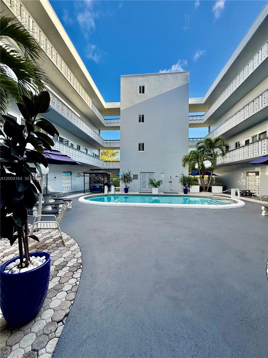 Don't miss this opportunity to own an excellent corner unit featuring spacious rooms, impact windows, tile flooring, a remodeled kitchen, and a new A/C system. The building is very well-maintained. Centrally located near major highways—just 5 minutes from the beach, Downtown Hollywood, and more!