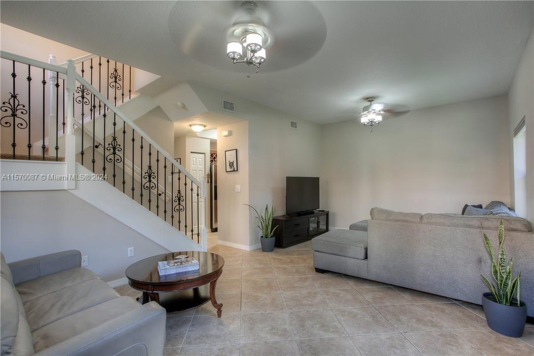 Beautiful 3 bedroom 2.5 bathrooms corner Townhome with a den! Modern tile floors on the 1st floor, laminate flooring in the master bedroom and carpet in the guest bedrooms and stairs. Kitchen has stainless steel appliances and granite countertops. Washer and Dryer inside the unit! All custom made closets and walk-in closet with shelves. Huge master bedroom and two great size guest bedrooms. Den downstairs that can be used as a home-office, tv room or even for your guests , how great is that? Bathrooms are beautiful! Townhome is located in the Villas at Harbor Isles, a gorgeous gated community located very close to I95 and featuring a community pool, jacuzzi ,playgrounds, and fabulous landscaping. Dania Point, the Fort Lauderdale airport, stores and the beach are just minutes away.