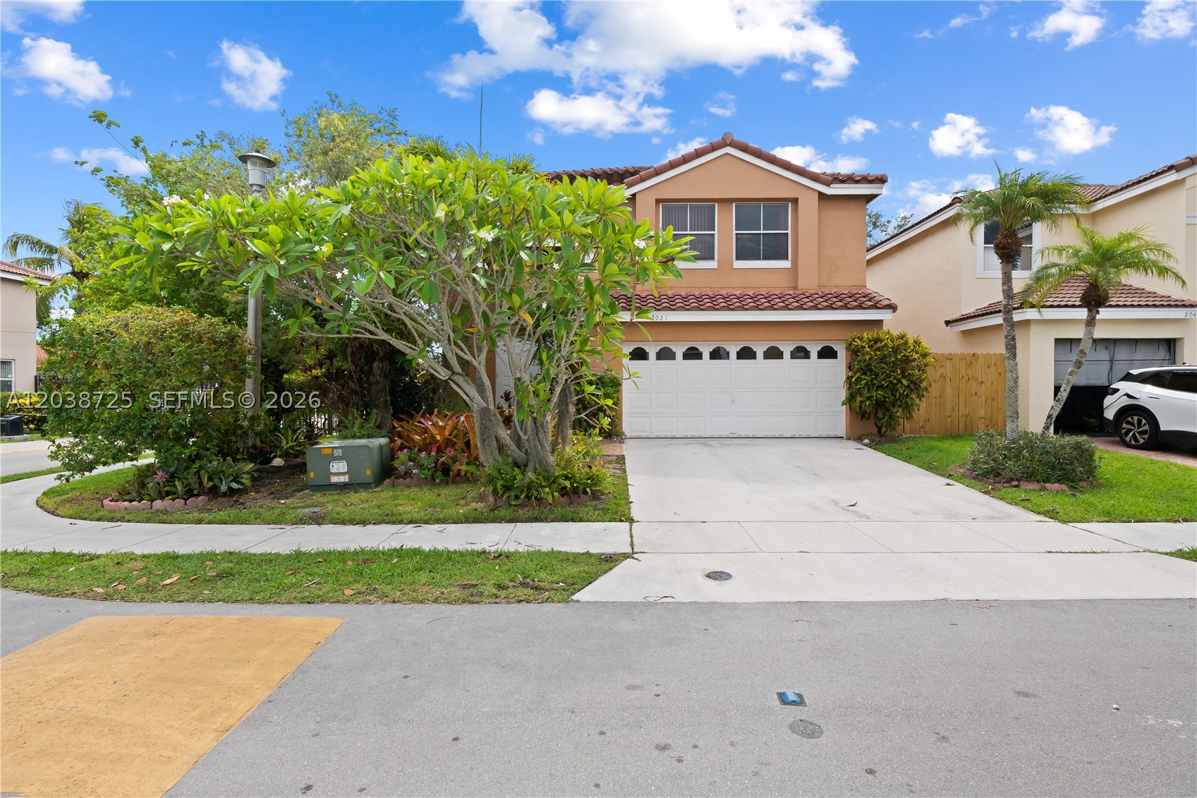 Welcome to this beautifully renovated 3 bedrooms/2.5 baths corner lot home located in a quite gated community. This immaculate move in 2-story home boasts a very spacious open floor plan with over 2,200 sq ft living space and it is ready for its new owner. Tile throughout, fresh interior paint, extra large primary bedroom, double car garage. Open kitchen, tile backlash, granite countertops, stainless steel appliances and wood cabinets. Upgraded bathrooms, roman tub and dual vanity. Additional upgrades: 2019 tile roof, 2018 A/C. Step outside and relax in your private backyard with lush landscaping. Enjoy the benefits of a gated community with low HOA. This is a must see property.