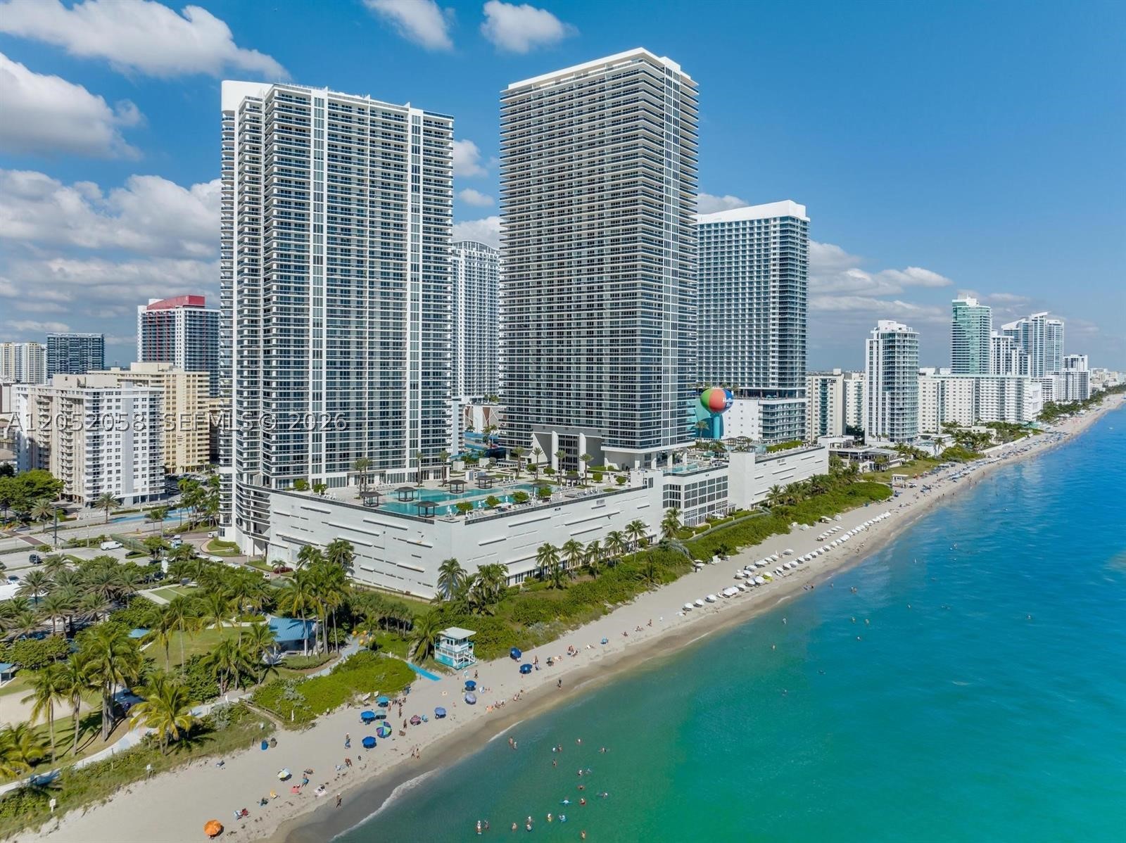 Immerse yourself in the epitome of luxury with this exquisite, fully furnished "pied-à-terre" at the prestigious Beach Club Hallandale Beach. Originally designed as a two-bedroom, this residence has been masterfully reimagined into an expansive one-bedroom suite, offering an unparalleled sense of space and comfort. Enjoy breathtaking sunset views from the generous balcony, and take advantage of the five-star amenities that include multiple oversized pools, hot tubs, 50,000 SF state-of-the-art gyms, a lavish spa, and a stylish restaurant with a bar. Unwind with umbrella and lounge chair service on the pool decks and beach. This residence also offers the added convenience of one assigned parking spot and valet service. Just bring your toothbrush!