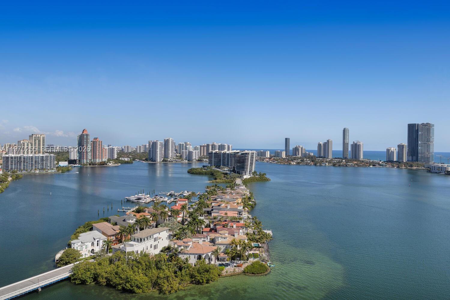 COMPLETELY RENOVATED!! and move-in ready residence offers elevated luxury living in the prestigious guard-gated community of Williams Island in Aventura. This stunning brand-new “home in the sky” showcases state-of-the-art design and pristine finishes throughout. Located on the 25th floor, the beautifully redesigned residence features a fantastic open flow floor plan with expansive living areas filled with natural light and breathtaking views of the Intracoastal, ocean, and city skyline. Contemporary flooring runs throughout the residence, complemented by linear A/C slot diffusers and refined lighting details that enhance the modern aesthetic. The spacious living and dining areas include a stylish wet bar, ideal for both everyday living and elegant entertaining. The modern gourmet kitchen is equipped with premium appliances, sleek custom cabinetry, and sophisticated designer finishes. Custom walk-in closets, motorized window treatments in the bedrooms, and meticulous craftsmanship further elevate the home’s comfort and functionality. Spa-inspired bathrooms feature rain showers and high-end fixtures, while the luxurious primary suite offers dual vanities and a relaxing, resort-style shower area designed for ultimate comfort.
