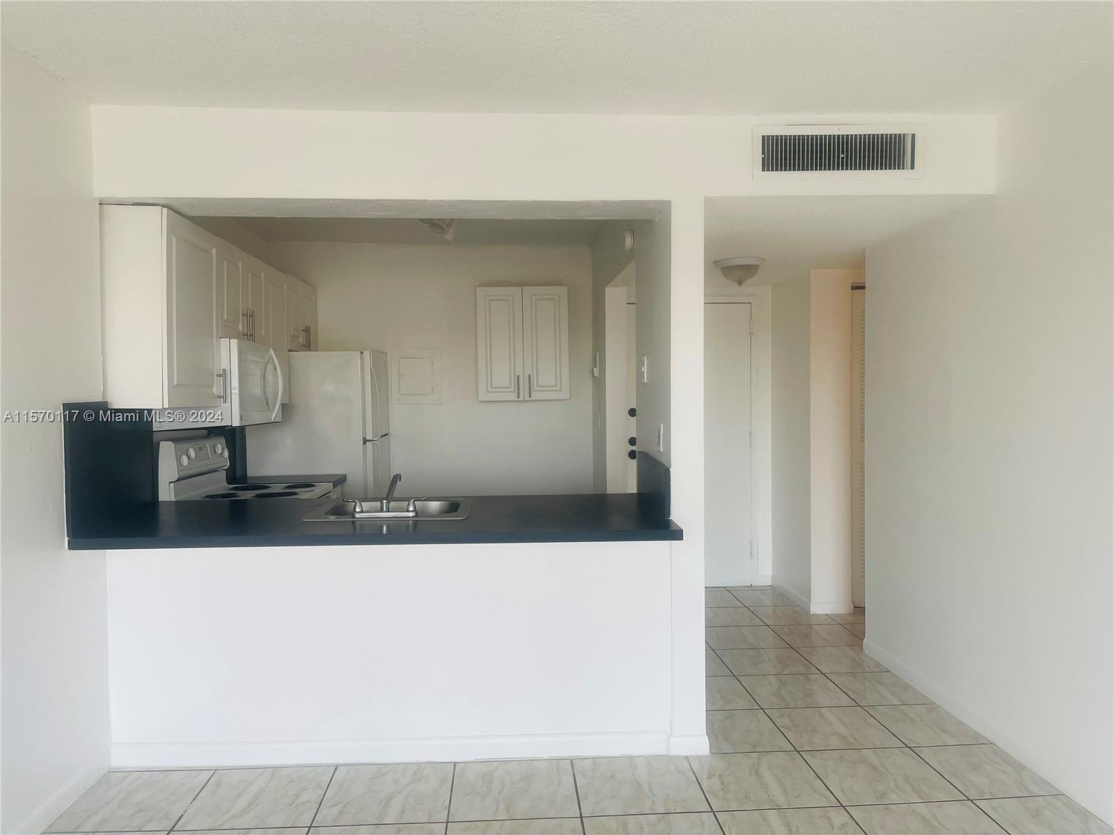 Centrally located and spacious 1 Bed/1 bath with balcony available now. Freshly painted, bright, tiled floors, walking closet, central air, balcony, and 1 assigned parking space. Close to highways and shopping centers. Onsite laundry. Minutes to the beach, Aventura Mall, Oletta Park, and the Brightline station.