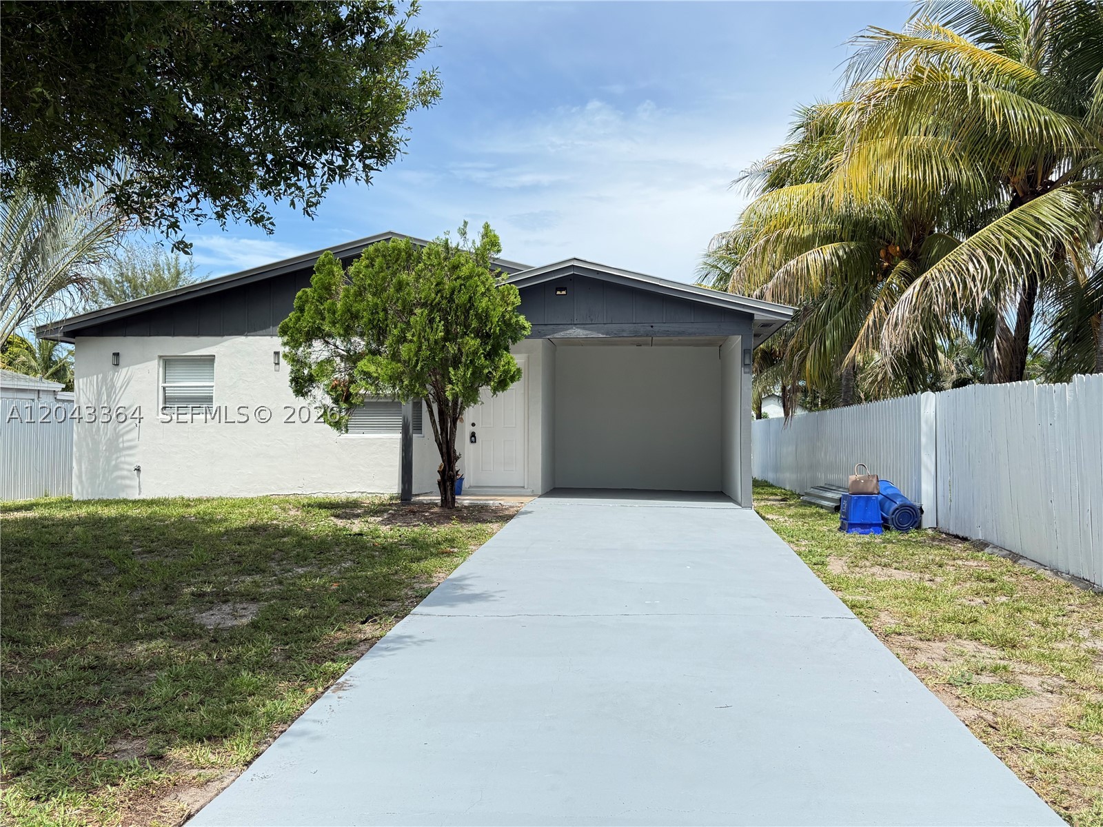 Great location in West Palm Beach! Conveniently located near Palm Beach International Airport, the Florida Turnpike, and I-95, offering easy access to Southern Boulevard, shopping, dining and everyday conveniences.
This cozy, move-in-ready home has been completely renovated with new kitchen cabinets, new flooring, and a beautifully updated bathroom. It also features a versatile extra room that can be used as a home office, guest room, playroom, hobby room, or even a spacious pantry—the choice is yours!
Enjoy added privacy with a canal behind the property, so no homes can be built directly behind you. Across the street, you'll find a small playground, making this home even more enjoyable for families.
Additional features include a separate laundry room and a nice-sized backyard with storage sheds that you can keep for extra storage or remove to create an even larger outdoor living space.
