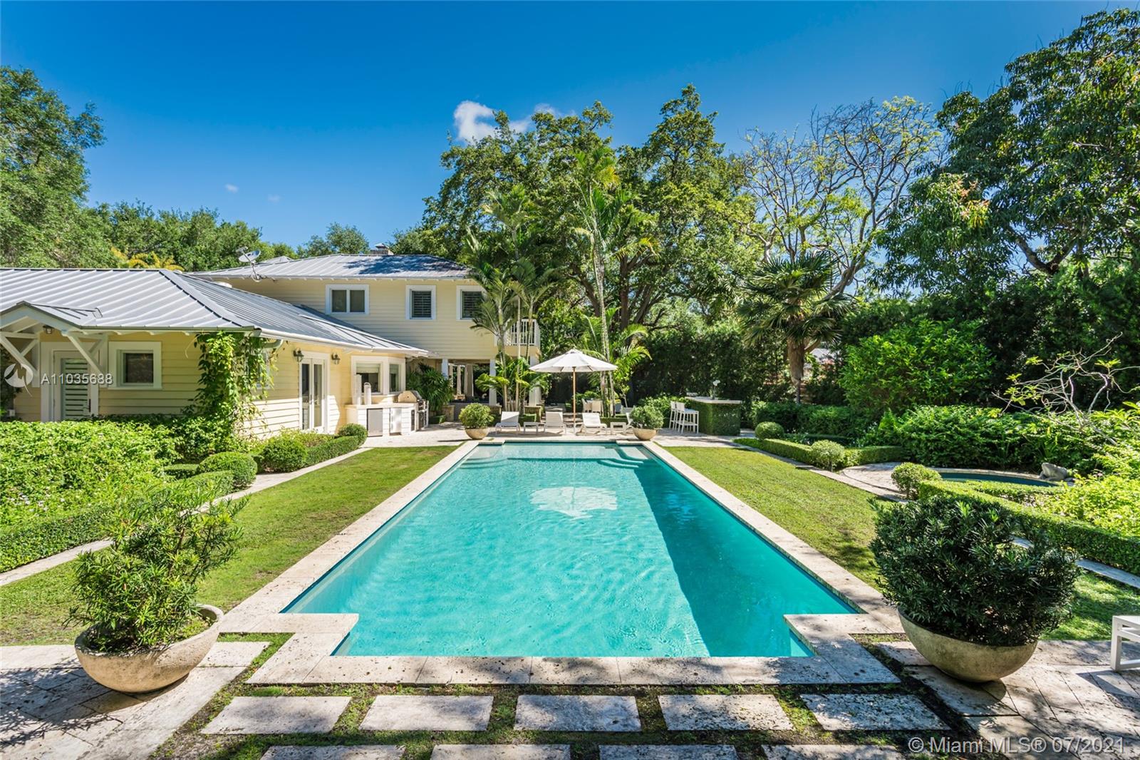 Spectacular “Old Florida” Key West style residence, located in highly desired Ponce Davis area. Surrounded by Oak trees, and a lush tropical landscape, this gated home is ideal for family living.  The tastefully decorated main house, is comprised of seven bedrooms, six baths, powder room, formal living room, dining room, family room, large eat-in kitchen, coffered ceilings, sound system, and state of the art security system. A separate guest house includes 2 bedrooms, 1 bath, living room and kitchen. The outdoor area was designed, by renowned landscape designer Fernando Wong, it includes a covered open-air living space, bar, pool, jacuzzi, and lounge areas, all surrounded by mature oaks and palms.  This compound includes, an air conditioned two car garage, and two gated parking areas.