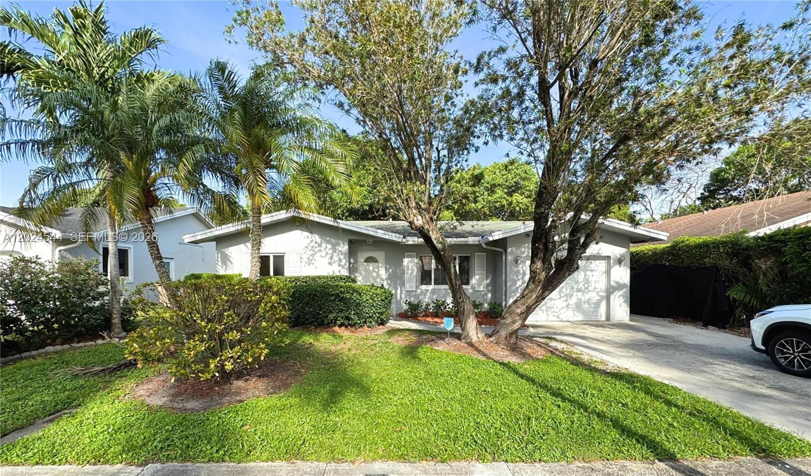 Recently updated 3-bedroom 2-bathroom single family home in a quiet neighborhood in Deerfield Beach with no association. Home features include tile throughout; spacious bedrooms; large open kitchen with stainless appliances; ample storage and closet space; separate dining and living areas; washer and dryer; driveway and attached 1 car garage; and fenced in backyard. Conveniently located near major roadways, grocery stores, restaurants, and Quiet Waters Park. Lawn maintenance included with rent. Application and screening required. Pet okay with additional fee. First month's rent, last month's rent, and security deposit due upon move in.