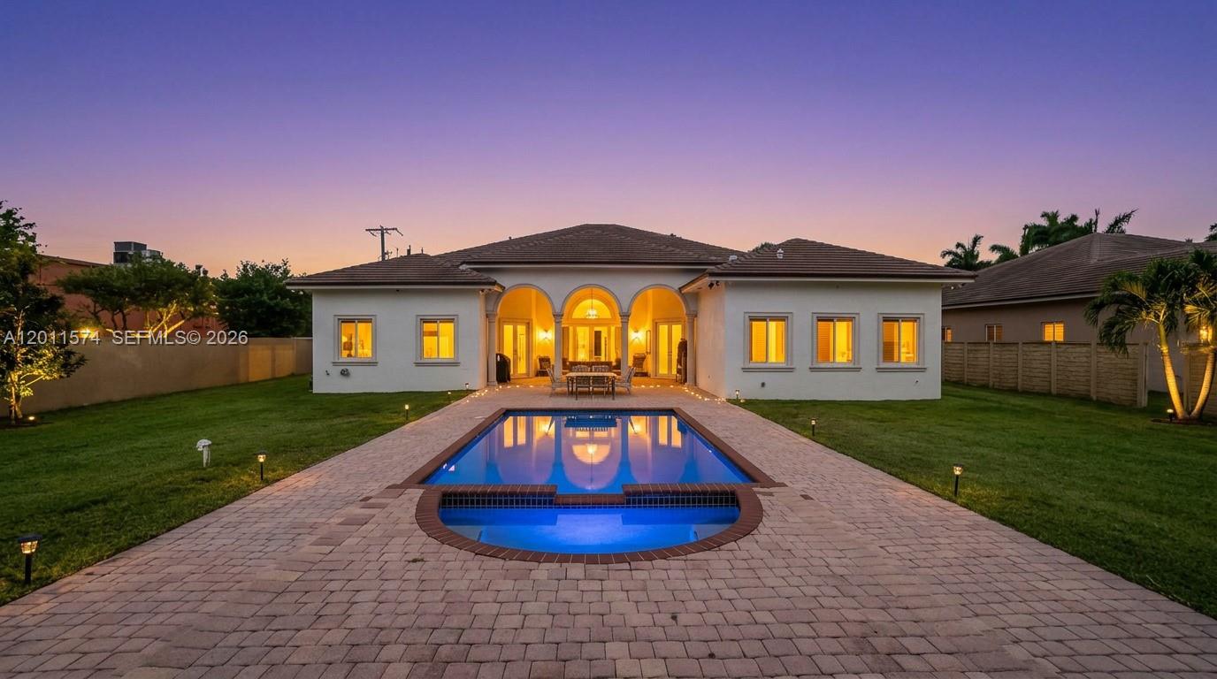 Experience elegance, comfort, and spacious living in this stunning 7-bedroom, 5-bathroom estate, nestled on an expansive 30,492 SF lot in the highly sought-after J.G. Heads Farms area. This meticulously maintained home features a brand-new roof and a grand circular driveway leading to a 3-car garage. Step inside to soaring high ceilings, exquisite marble floors, and an impeccable layout designed for both grand entertaining and relaxation.  
The outdoor oasis is a true showstopper, featuring a massive gazebo equipped with its own kitchen, bedroom, and bathroom—perfect for a private guest retreat or poolside hosting. Perfectly situated in the quiet Tamiami neighborhood, you are just minutes from the Florida Turnpike, bird Road, and top-rated schools like Greenglade Elementary and Air Base K-8. Enjoy the tranquility of a sprawling 0.7-acre lot while remaining close to shopping, dining, and easy highway access. Don’t miss this rare opportunity—schedule your private tour today!