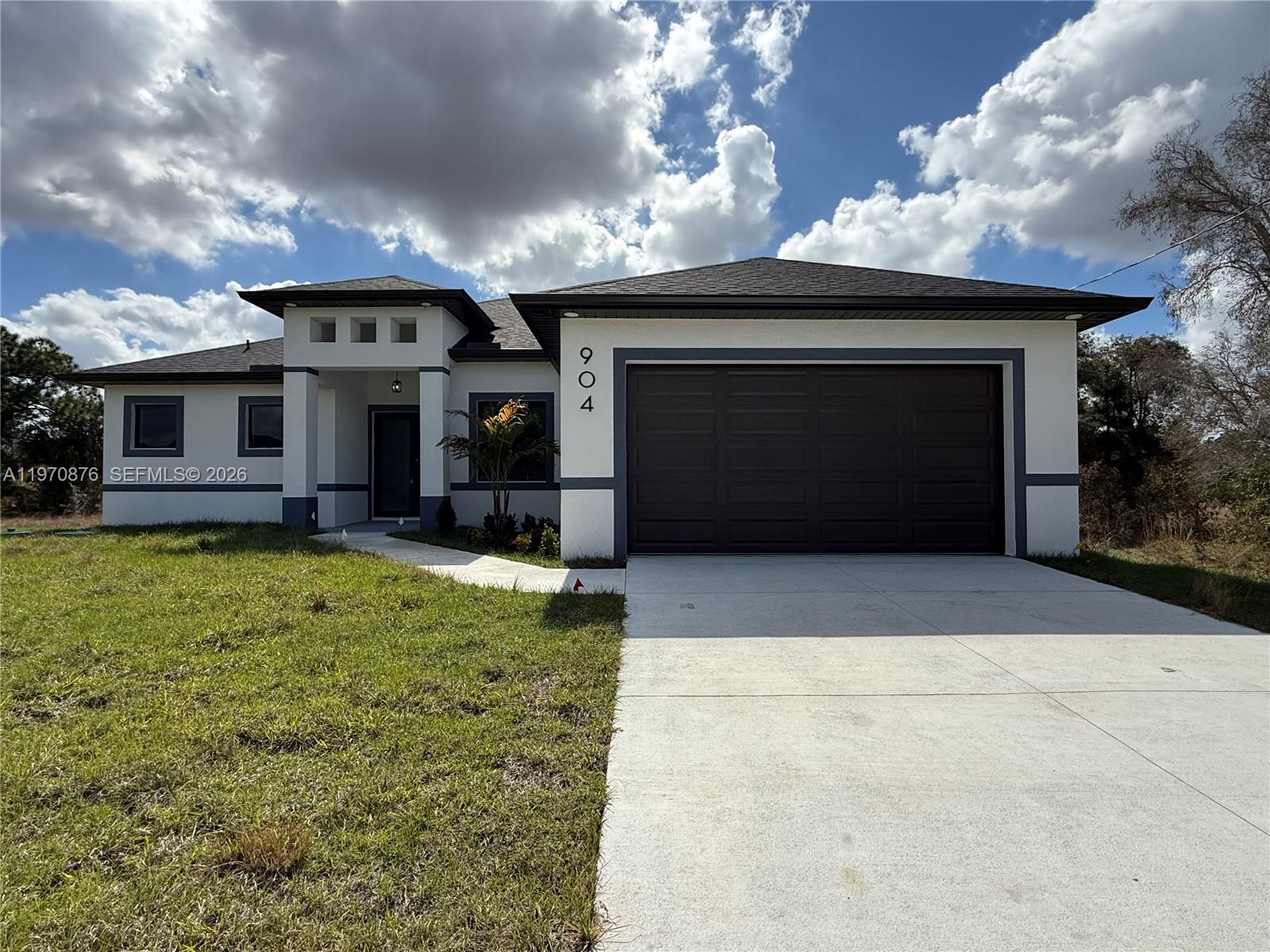 904 Asher St, Lehigh Acres, FL 33974 Beautiful 3 bedroom + den, 2 bathroom home featuring modern touches throughout. Enjoy porcelain tile flooring throughout the entire home and stunning modern light fixtures that elevate every space. The kitchen shines with quartz countertops, shaker cabinets, and a stylish backsplash, all flowing into an open, functional layout perfect for everyday living. The spacious primary suite offers two walk-in closets, while the additional bedrooms provide comfortable space and ample storage. Conveniently located near SR-82 and close to schools, shopping, and dining — combining comfort, style, and location in one great home.