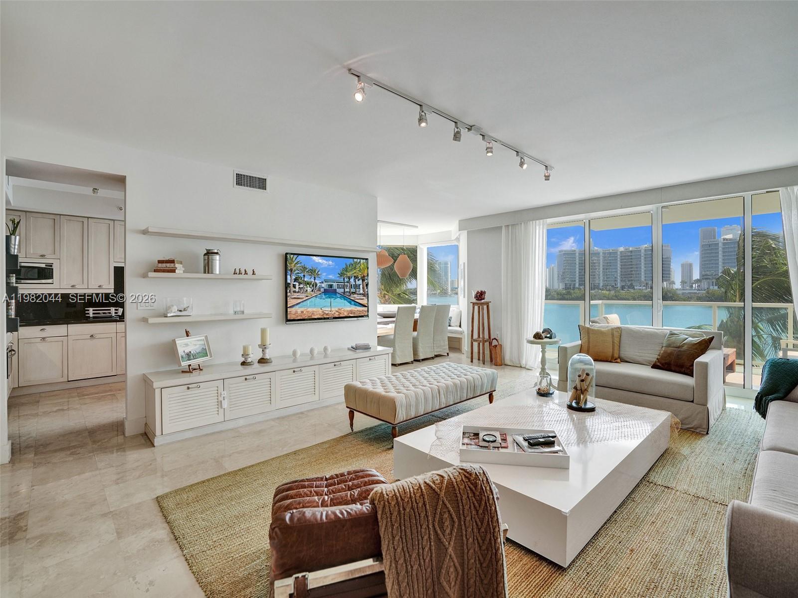 Step into this stunningly renovated and furnished apartment offering unparalleled views of the Intracoastal Waterway. With 4 exquisite en suite bedrooms plus a den and maid's quarters, this residence exudes sophistication and elegance at every turn.Each bedroom is a haven of comfort and style, boasting its own private bathroom for utmost convenience and privacy. The den provides flexible space for work or relaxation, while the maid's quarters add an extra layer of practicality.From the moment you enter, you'll be captivated by the meticulous attention to detail and the seamless blend of modern design elements with timeless charm