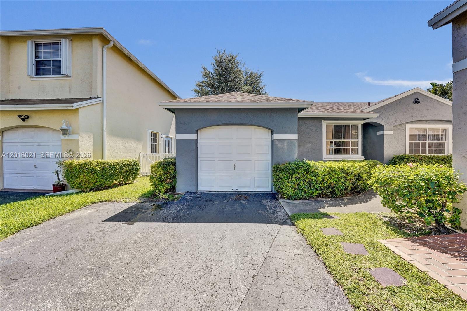 Welcome to one of the BEST DEALS in Pembroke Pines! Nestled on a quiet cul-de-sac inside the highly desirable guard-gated community of Pierpointe, this original-owner 3 bedroom, 2 bathroom single family home offers the perfect opportunity to create the home of your dreams in one of the most centrally located areas of Broward County! From the moment you walk inside, you’ll love the soaring vaulted ceilings, spacious living areas, and incredible natural light that make this home feel warm and inviting. The oversized 3rd bedroom was thoughtfully expanded by reducing the garage size, creating an enormous room perfect for a second primary suite, game room, home office, gym, or media room! Garage still offers approximately 6 feet of storage space in both the front and rear areas.  Enjoy true South Florida living from the HUGE screened-in porch — the perfect space for entertaining guests, relaxing with your morning coffee, or enjoying peaceful evenings outdoors year-round. Major updates include a NEW A/C (May 2026) and newer roof (2016), giving buyers peace of mind on some of the home’s biggest-ticket items.  House needs some tlc great bones!