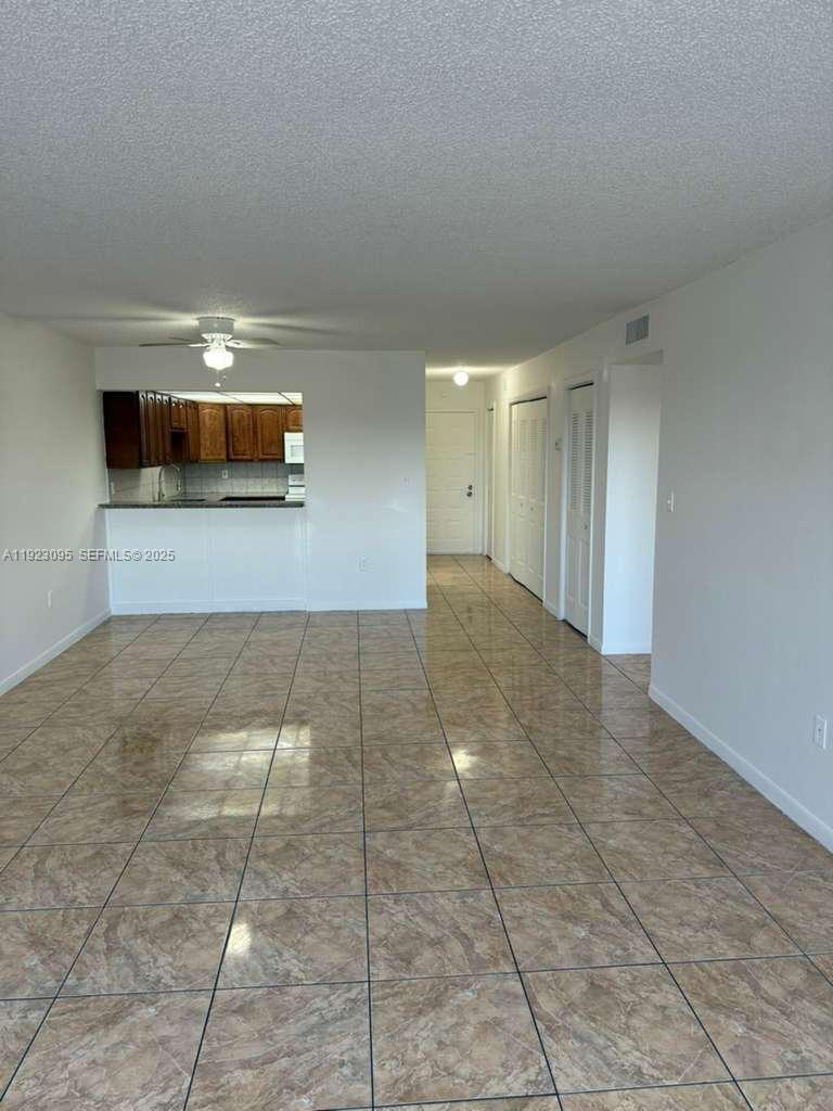 GREAT CONDITIONS 2 BEDROOMS,1 BATH, CORNER UNIT WITH 2 BALCONIES IN CORAL GATE WEST. FRESHLY PAINTED, TILE FLOORS THROUGHOUT, UPDATED KITCHEN AND BATH, BRAND NEW A/C RECENTLY INSTALLED, WALKING DISTANCE TO SHOPS AND NEAR TO MAIN HIGHWAYS (I75 AND 826). CONDO HAS POOL, GYM, BASKETBALL, AND CHILDREN'S PLAY AREA. MINIMUM CREDIT SCORE OF 630 AS PER ASOCIATION. A MUST SEE, DON'T MISS OUT!