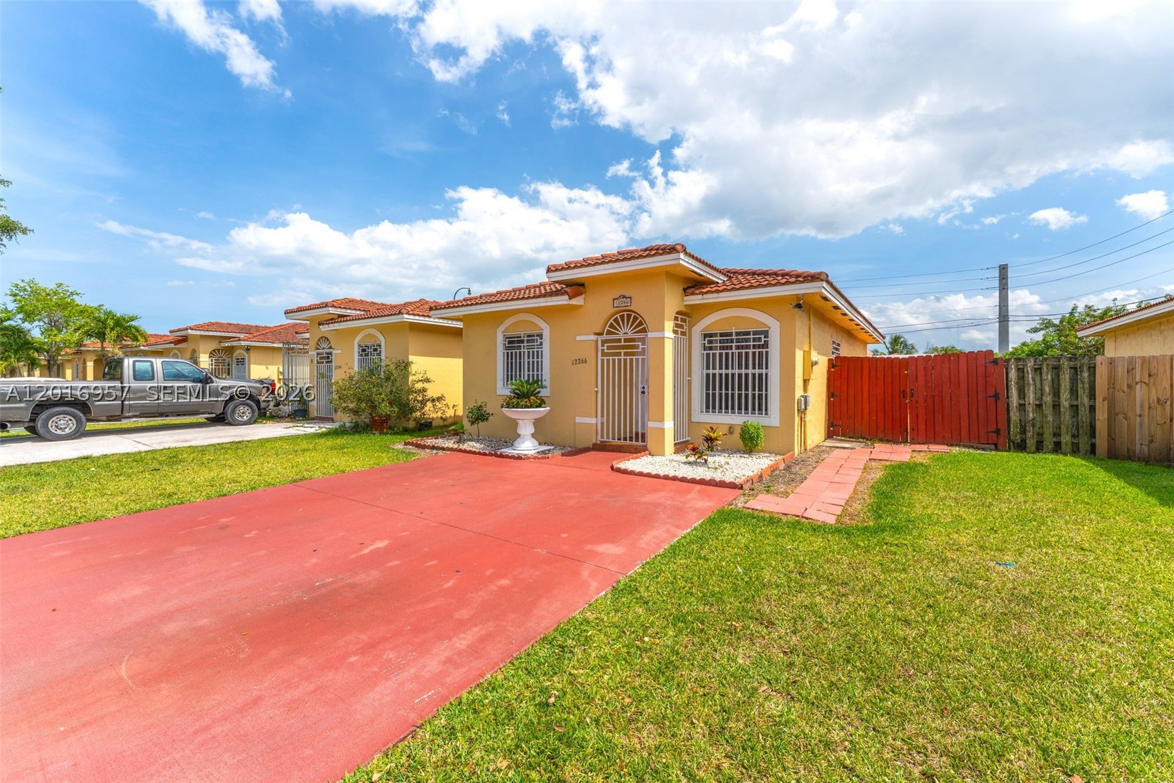 Beautiful 3 bedrooms and 2 bathroom twin home built in 2005 in excellent conditions. Tile floor. New pergola in the terrace. Windows protected. Plenty of parking spaces. This property features side entrance perfect for storing a boat or jet ski . Charming and perfect for a family. Large concrete patio is ideal for entertaining. Low monthly association. Good location with easy access to shopping. Just minutes away from Publix, Walmart and Black Point Marina, and South Dixie Highway(US1).Exit 11th of turnpike.*The property may qualifies for a 5% loan or FHA + additional help for buyer's closing costs with a preferred lender.