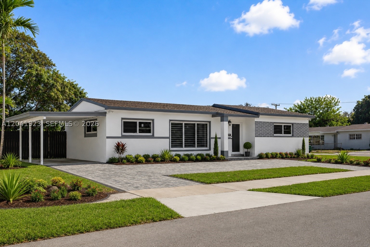 Beautifully renovated and thoughtfully upgraded, this exceptional corner-lot residence immediately stands out with its inviting curb appeal, newly designed driveway, impact windows, and modern enhancements throughout. Designed for today’s South Florida lifestyle, this move-in-ready home blends comfort, style, and functionality while offering the warmth and feeling of a true forever home.

From the moment you arrive, the property showcases pride of ownership and the kind of meaningful renovations buyers are searching for. Inside, enjoy bright and welcoming living spaces, renovated bathrooms, updated finishes. Step outside to your expansive private backyard, the perfect setting for family gatherings, outdoor dining, weekend barbecues, or simply enjoying Miami living year-round. The oversized corner lot features a side carport ideal for your boat and RV, creating the perfect blend of lifestyle, convenience, and versatility.

Offering a unique combination of modern upgrades, outdoor space, impact protection, and move-in-ready convenience, this property is an exceptional opportunity for buyers seeking comfort, functionality, and long-term value in a home that truly stands above the competition.