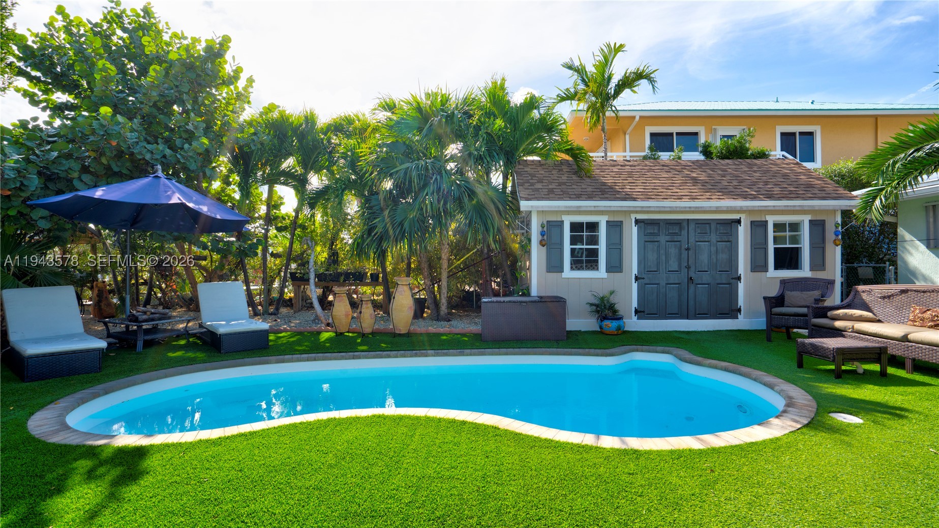 Beautiful Double Waterfront Lot in Prestigious Plantation Key Colony. This stunning 4-bedroom, 2-bath waterfront home sits on a Rare Double Lot with a Private Boat Ramp & Boat lift. Step outside to your Private Oasis complete with a Private Tiki hut - Gorgeous secluded in-ground Pool and Cabana Hut Bungalow - The open-concept kitchen features Granite countertops and stainless-steel appliances, ideal for effortless entertaining—Perfect for Boaters and outdoor enthusiasts. Tucked away in a quiet neighborhood, yet just minutes from restaurants, shopping, and top-rated schools, this home truly offers the best of island living.