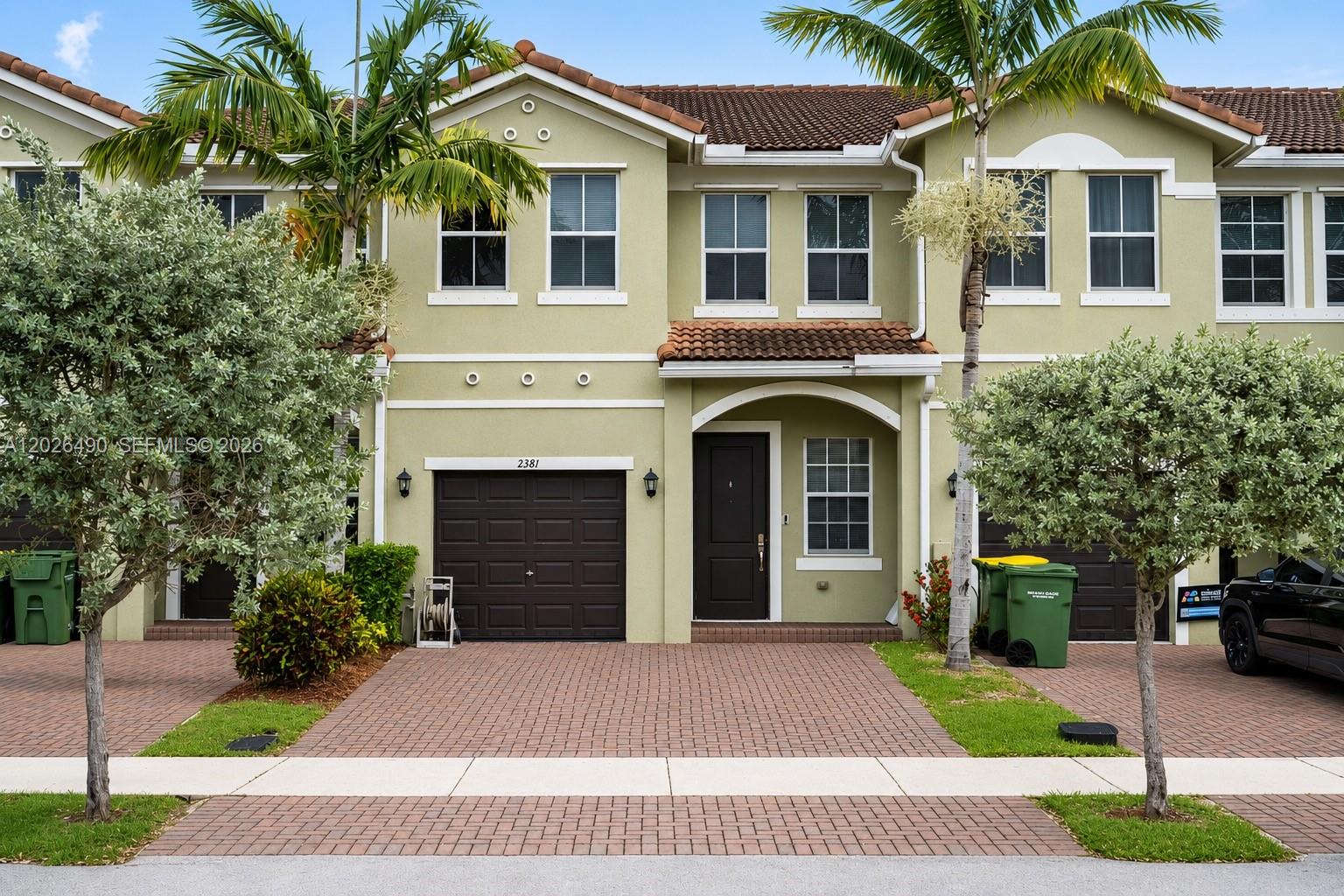 Beautiful 4 bedroom, 3 bathroom townhome with serene lake views in the heart of Homestead. Built in 2018, this 1,916 sqft two-story residence offers modern open-concept living perfect for families and entertaining. The first floor features a bright living and dining area that flows seamlessly into the kitchen with generous cabinet space. Step outside to your private patio overlooking the tranquil lake, a rare backdrop you'll love coming home to every day. Upstairs you'll find a spacious primary suite with en-suite bath, plus three additional bedrooms and a full guest bath, providing plenty of room for family, guests, or a home office setup. Attached 1-car garage with additional driveway parking. The well-maintained community offers low-maintenance Florida living with HOA covering exterior upkeep and common areas. Ideally located minutes from the Florida Turnpike and US-1 for an easy commute, and close to shopping, dining, parks, hospitals, and major retail. Just a short drive to the Florida Keys, Biscayne National Park, and downtown Miami. Whether you're searching for a primary residence, vacation getaway, or a solid rental investment in one of South Florida's fastest-growing markets, this lakefront townhome checks every box. Move-in ready and priced to sell schedule your private showing today!