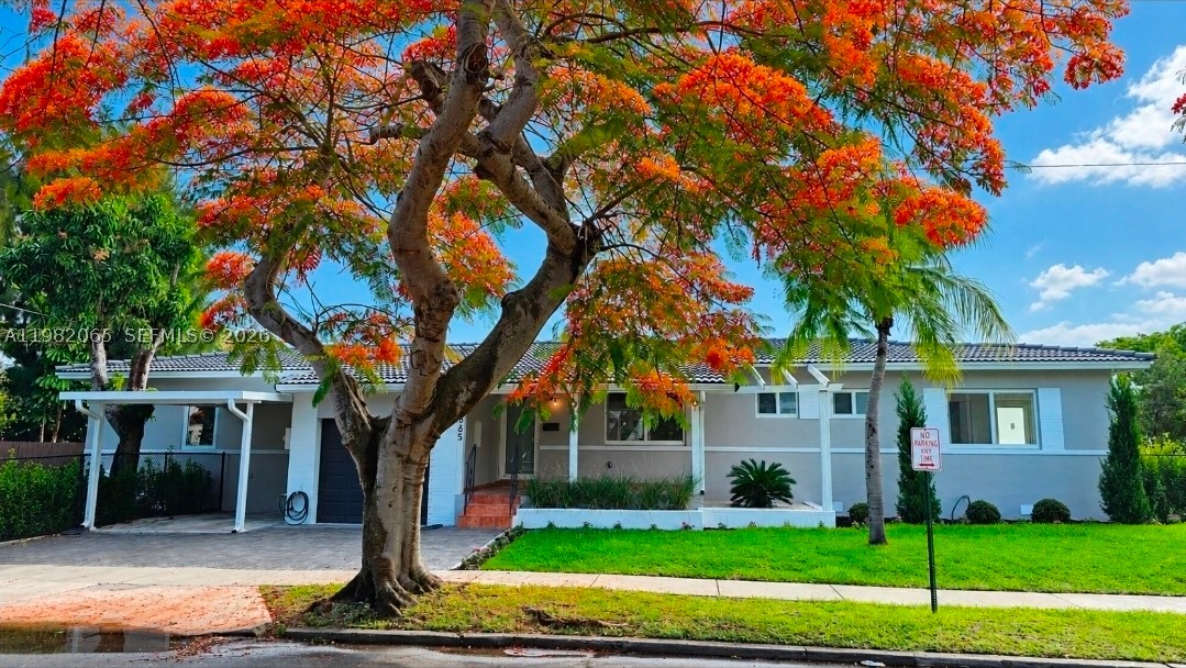 This single family home is in one of the most sought after neighborhoods, Silverbluff which is located north of Coconut Grove and south of Shenandoah.  This is a beautifully renovated mid-century modern home that was tastefully done in an organic modern feel.  The home is a 4 bedroom 3 bathroom home that is perfectly situated with 2 primary suites perfect for in-law, nanny, guest, or teen quarters.  The living room has a custom designed electric fireplace that compliments the kitchen cabinets and kitchen backsplash tile with a gorgeous dining room mural that combines all the textures with the warmth of a home but the appeal of a modern condo.  There is a designated room perfect for a theatre, gaming, family room, or children's play area.  Part of the home can be easily separated to make a designated full in-law or a massive primary quarters.  The home sits on a corner lot which provides two designated fenced in yard spaces.  One space is perfectly designed for outdoor entertaining with wood decking tiles and string lights.  The exterior does have a well system and pump for sprinklers, extra parking in the rear of the home, and exterior lighting.  This home does have a full single car garage that can easily be converted into more storage space, flex zone, or a full gym.  This is a must see home that has been tastefully done to meet any buyer's needs.