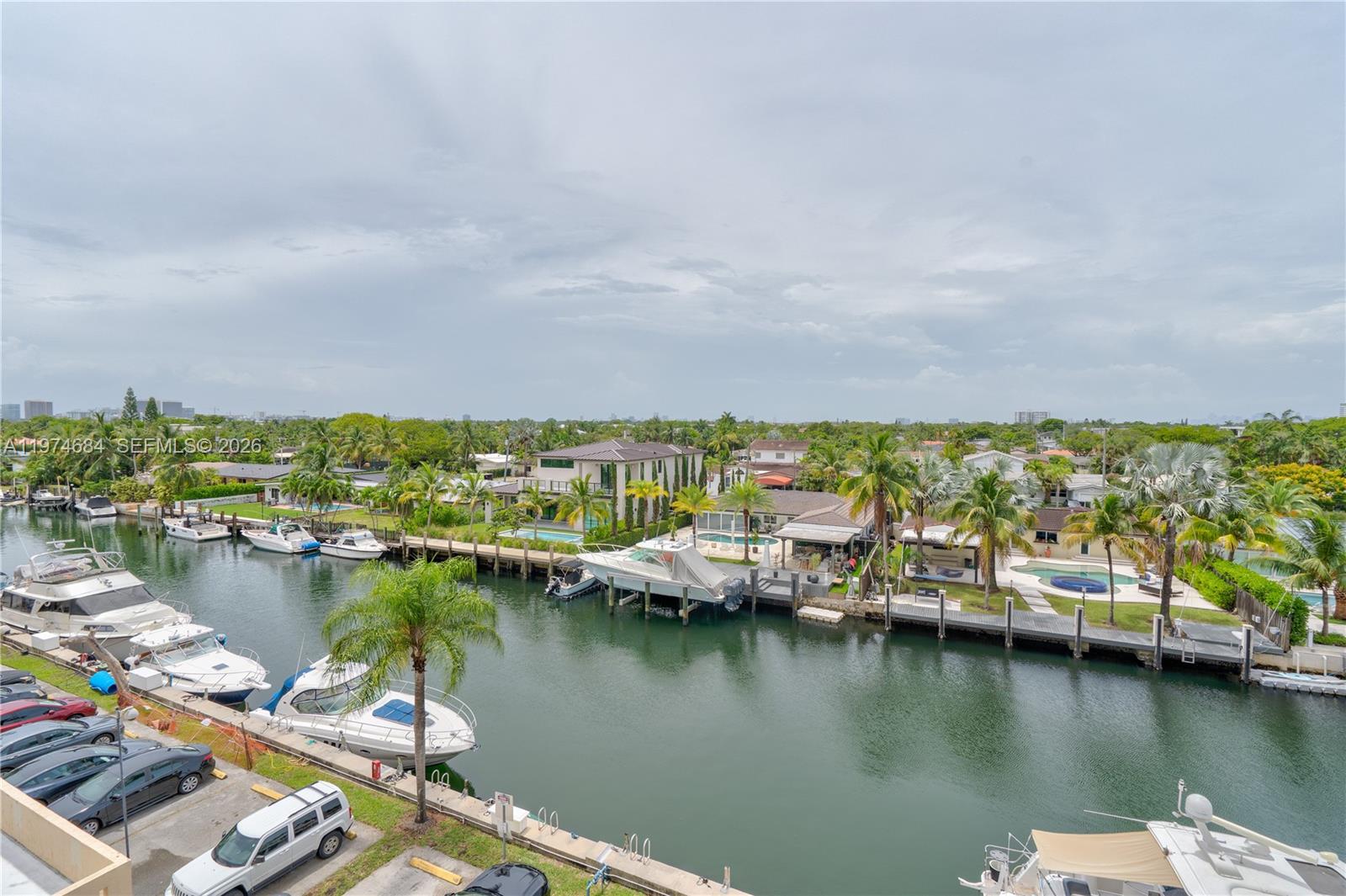 2 PARKING SPACES INCLUDED! This 2/2 apartment boosts a very spacious layout. Freshly painted, new floors and bathrooms. This apartment has beautiful views of the canal. This building has a gym and swimming pool on the beautiful canal.