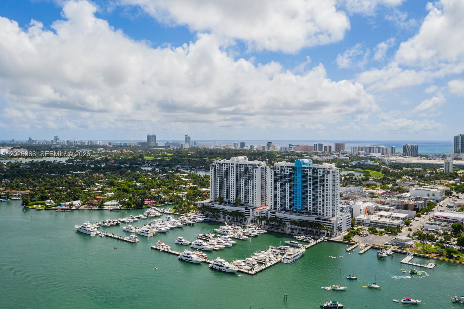 Experience refined coastal elegance in this masterfully reimagined 3BR/3BA sanctuary on the coveted west side above Sunset Harbour Yacht Club . Spanning 1,900+ square feet, this residence is a masterclass in contemporary design, where walls of glass frame unobstructed views of the shimmering bay, the marina, and the iconic Miami skyline.

The seamless layout flows onto three private terraces—accessible from every room—inviting the golden hour glow inside. At the heart of the home, a custom chef’s kitchen serves as a culinary showpiece, featuring induction technology, a social island, and dedicated wine storage. Each bedroom is a private retreat with an en-suite bath, balcony, custom closets and the convenience of electric shades.

This condo is your entry into the exclusive Sunset Harbour lifestyle.  Residents enjoy luxury amenities including a bay-view fitness center, sauna, resort deck, 24/7 doorman, and specialized storage for bikes and paddleboards. The residence also includes two deeded parking spaces, valet and available EV charging.
From your doorstep, wander the bay walk to Maurice Gibb Park or indulge in the world-class dining and wellness boutiques that define Miami’s most walkable, sophisticated neighborhood. This is modern luxury, perfectly positioned.
The building is months away from completing a $12M transformation, further elevating its status and resident comfort.  Assessment paid in full by seller, and HOA has excellent finances and reserves