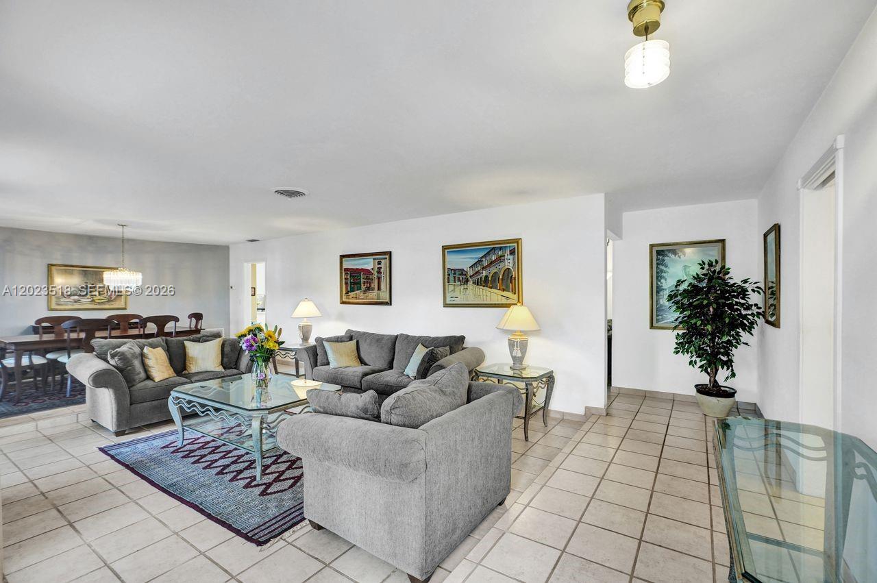 Beautiful home in a prime location within the highly sought-after Kendall Point neighborhood, just steps from  Baptist Hospital and Dadeland Mall. The area is served by excellent public and private schools. This spacious single-story residence offers 2124 square feet of living space, featuring 3 bedrooms, 2 bathrooms, a generous family room, an open-concept kitchen, an a 2 car-garage.
Enjoy outdoor living with an expansive patio and a large, covered terrace perfect for entertaining and gatherings.
