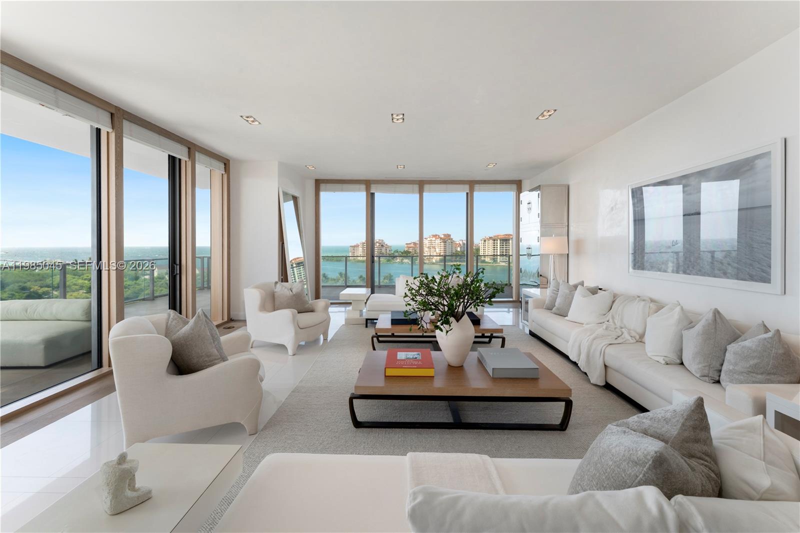 Crafted by the acclaimed designer Luis Bustamante, this turnkey residence at the prestigious Apogee presents a sophisticated living experience with sweeping views of the ocean, Fisher Island, and the city skyline. As you enter, you'll discover a spacious, light-filled floor plan featuring 4 bedrooms, 3.5 bathrooms, and a private media room. The gourmet kitchen is equipped with state-of-the-art appliances and opens to a terrace with a gas grill for al fresco dining. Apogee offers unparalleled amenities, including a fitness center, pool, and 24-hour concierge, ensuring luxury and peace of mind. Situated in the coveted South of Fifth neighborhood, this residence is just moments from Miami’s premier dining destinations.
