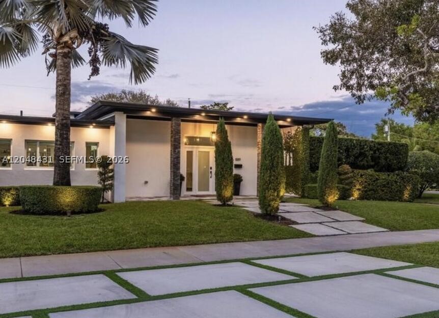 Mid-century modern 4bed/4bath pool home on oversized corner lot in the heart of Miami Shores. Renovated with sophisticated design & contemporary updates. Spacious open concept living with high ceilings and seamless flow from grand living & dining areas. Kitchen features a center island, breakfast nook, wine bar and abundant storage. Primary suite with dual closets & spa-like bath. Backyard paradise with covered area and heated saltwater pool & spa includes premium turf decking throughout. Garage with epoxy floor. Recent updates include renovated baths, commercial-grade roof coating, updated plumbing, landscaping, aluminum fencing, EV charging, security cameras & more. Located near top schools, country club, recreational facilities, and downtown. Move-in ready gem with the best neighbors.
