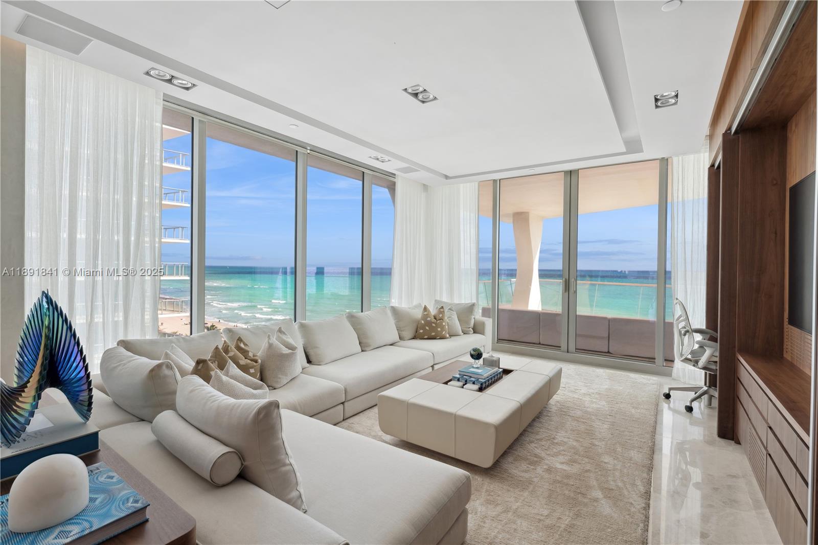 This 4 Bedroom 5-1/2 Bath corner home has palatial space as well as views from every direction.  Flowing from the Atlantic Ocean to the city this home has it all!  Upgraded ceilings, wood paneling throughout entertainment space.  the Master Bedroom and Master Bathroom are facing the Ocean.  The Building is a 5 star building with a sit down restaurant, childrens room, billiard room , game room and full gym and spa.  Move in and never want to leave.  Easy to show, call listing agent.