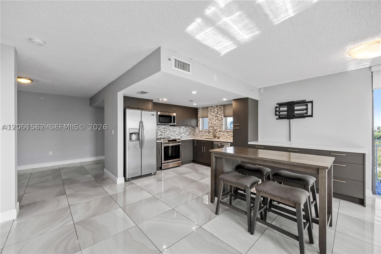 Updated Modern and Spacious residence in a Waterfront Boutique Bldg. in Amazing Eastern Shores N.M.B. Sunny Isles Location. Move in Ready Bring your toothbrush kind of condition. Enjoy all the conveniences of a single family or townhome without all of the Maintenance. Covered Parking and Washer and Dryer in the Unit. Community Pool and Covered Patio. Gated w/ card access. Minutes from Us-1 and A1A makes it a super convenient spot. Quiet Cul-De-Sac Street. Motivated Seller wants offers. Easy to show by appointment with enough notice.
