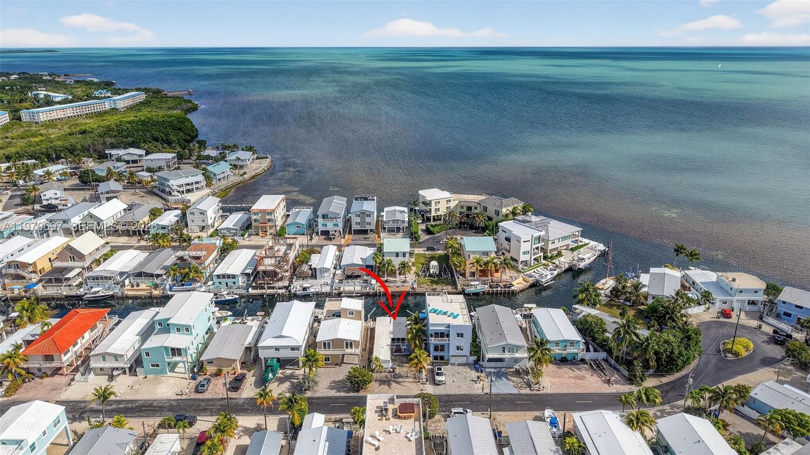 Canal front opportunity with direct ocean access! Located in a highly desirable waterfront neighborhood near Harry Harris Park, this 2-bedroom 2 bath mobile home offers unbeatable location and boating access. Enjoy close proximity to the beach, boat ramp and all the conveniences of Tavernier Town Center, including shopping, restaurants, a movie theater and more. Situated on deep water with direct ocean access, the property features a concrete seawall with davits, making it a true boater’s and fishing haven. Outdoor sink provides the perfect fish cleaning area, plus two utility/storage rooms under the deck for added functionality. The home includes parquet flooring, washer and dryer hook up and microwave, refrigerator, oven and gas range. While the property is fully functional, it presents an excellent opportunity for renovation, updating or potential re-development to maximize its prime canal-front location. Whether you’re looking for a keys getaway, investment opportunity, or the perfect spot to create your own waterfront retreat, this property offers exceptional potential in an unbeatable setting.