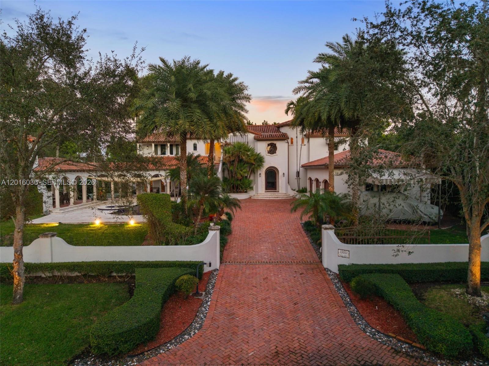 BOATER’S DREAM IN EXCLUSIVE HAMMOCK OAKS! Rare opportunity to own a Spanish-inspired estate with double boat slips and a private 75-foot dock equipped with water and electric, offering direct ocean access to Biscayne Bay within minutes. A truly unique offering for boating enthusiasts seeking the ultimate South Florida waterfront lifestyle in a prestigious guard-gated community.

Additional highlights include a three-car garage with hydronic car lift, additional covered parking, central vacuum system, permanent whole-house commercial-grade Generac generator with automatic transfer switch, and a mosquito repellent system for year-round outdoor enjoyment.

Designed for luxury living and sophisticated entertaining, the home showcases soaring ceilings, marble and wood flooring, intricate millwork, and handcrafted stone and tile accents throughout. A chef’s kitchen with top-of-the-line appliances flows seamlessly into expansive family and media rooms, while the custom bar area with designer ice machine elevates the entertainment experience.

Outdoors, lush tropical landscaping surrounds a resort-style pool and expansive entertainment areas, including a covered gazebo with built-in grill, half-court basketball and sports court.