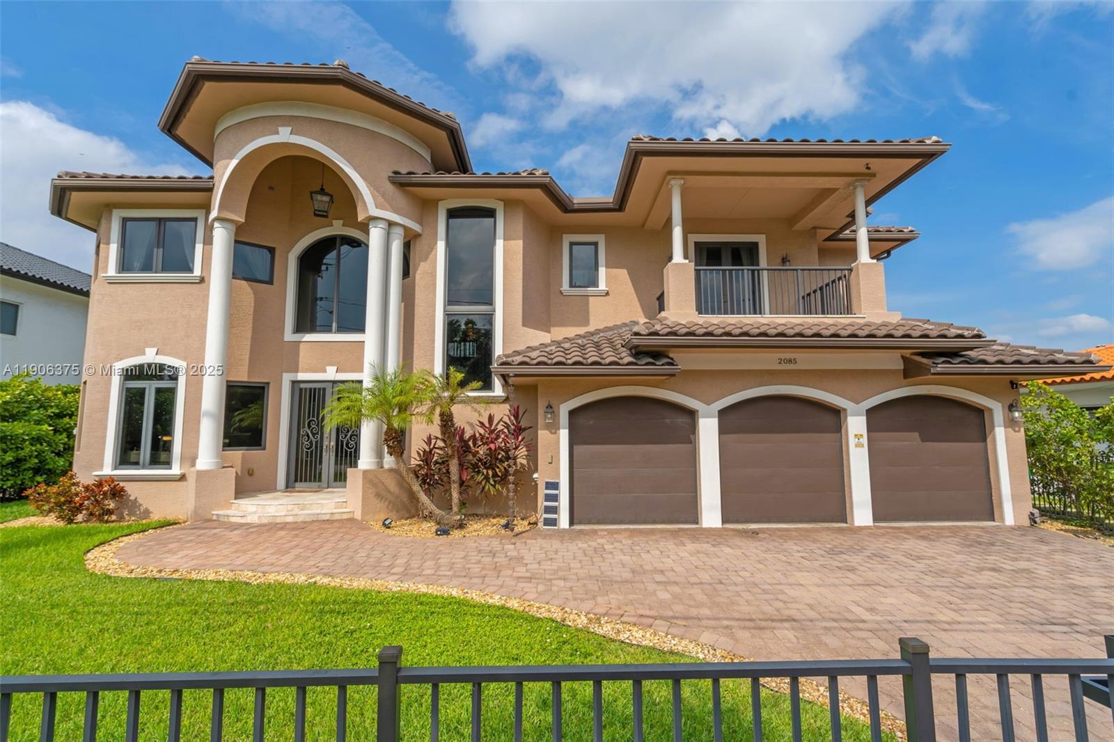 Beautiful two-story waterfront home built in 2017, located in the prestigious guard-gated Keystone Islands of North Miami. This 5-bedroom, 6.5-bath residence offers modern luxury with marble floors throughout, soaring ceilings, impact windows, and a private elevator. Each bedroom is an en-suite, providing comfort and privacy. The spacious primary suite features dual walk-in closets and a spa-like bathroom. Enjoy a true entertainer’s paradise with a covered patio, outdoor kitchen, and heated pool surrounded by lush landscaping. A private oasis with an exclusive private dock spanning 83' of prime waterfront on the Intracoastal, just minutes to the ocean. Park your yacht in your own backyard and experience the best of waterfront living. Owner Motivated!