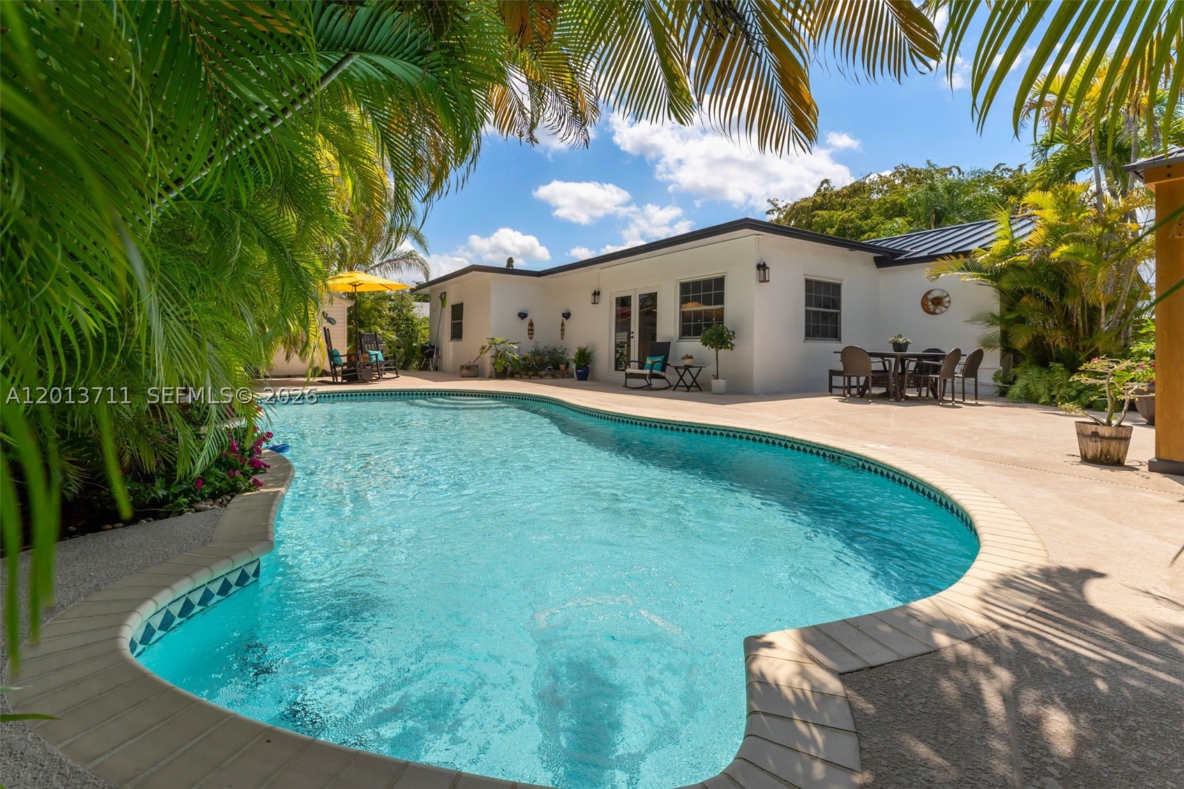 Welcome to 6651 SW 148 Ct, a light-filled and thoughtfully upgraded home in a prime West Kendall location known for its top-rated schools and convenient access to everything. This 3 bedroom + office residence features a brand new metal roof less than 1 year old, impact windows throughout, and a modern kitchen with stainless steel appliances and a spacious walk-in pantry. The layout flows seamlessly into an incredible backyard designed for entertaining, complete with a pool and a separate covered gazebo, plus side access with room for a boat or RV. The remodeled guest bath showcases an organic modern design with a live edge wood vanity and high-end porcelain tile finishes. The spacious primary suite offers a walk-in closet and a comfortable retreat feel, all complemented by bright, open living areas that make this home as functional as it is inviting. This is a turnkey opportunity in a highly desirable location close to top schools, parks, shopping, and major roadways.