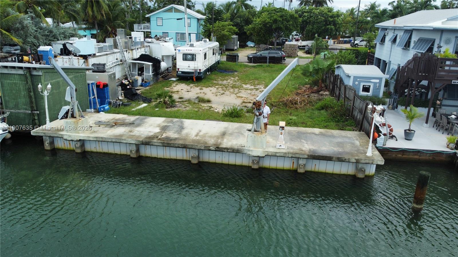 93 N Conch Key is a waterfront development opportunity offering a newly constructed seawall, approved building plans, and the ability to move forward without many of the delays and costs typically associated with waterfront development in the Florida Keys. The approximately 5,000-square-foot parcel includes plans for a new dock and seawall improvements and presents the potential for up to four residential units, subject to applicable approvals and requirements.

Positioned in the desirable Conch Key community, the property offers direct water access, open water views, and convenient boating access to some of the Keys' most renowned fishing, diving, and recreational waters. The combination of existing waterfront improvements and approved plans provides a significant head start for developers, investors, or end users seeking to maximize the property's potential.

Whether envisioned as a private waterfront retreat, a multi-unit investment property, or a combination of personal and income-producing use, 93 N Conch Key offers a rare opportunity to acquire a build-ready waterfront site in one of the Florida Keys' most established and sought-after island communities.