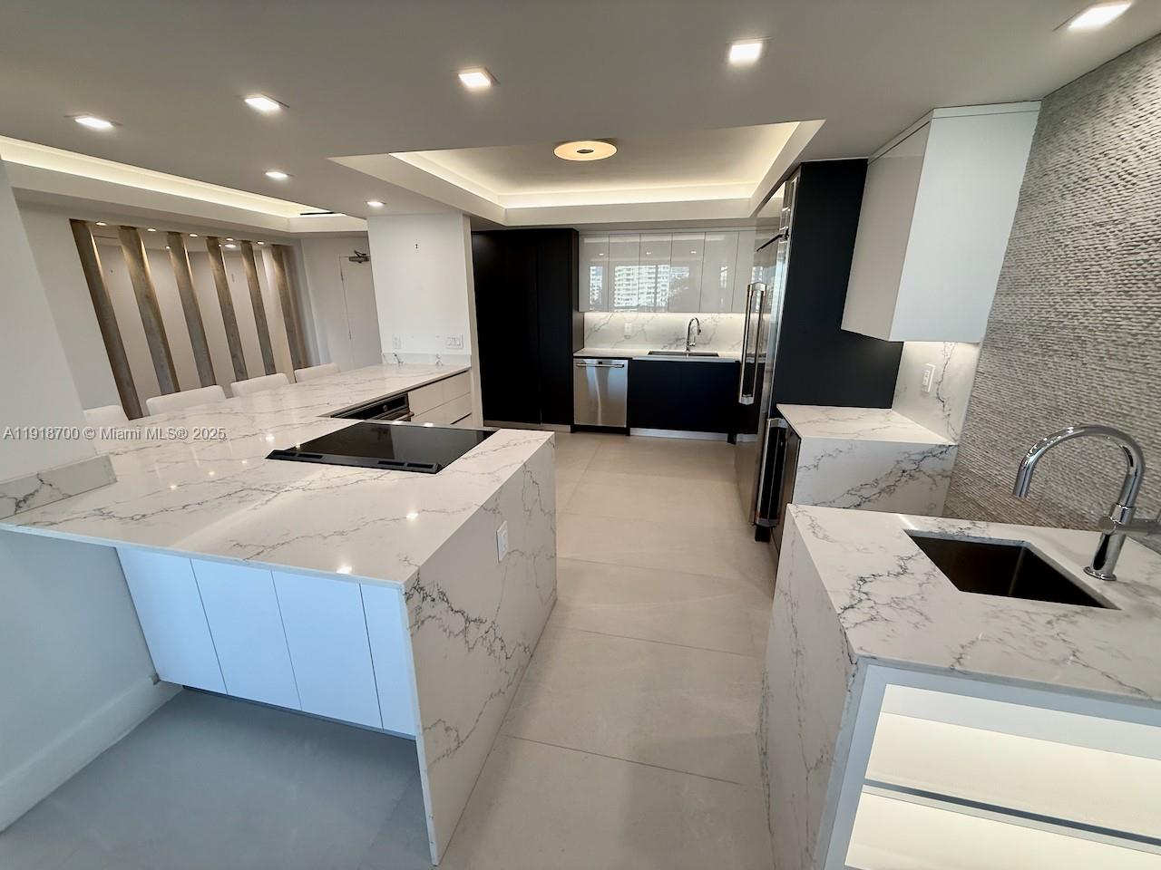 Stunning Bayfront Renovation in Miami Beach (NoBe)

Fully renovated in 2021, this modern waterfront residence offers a serene, resort-style lifestyle just a 15-minute walk to the beach. Designed for comfort and entertaining, the home features an open living space with floor-to-ceiling windows, a large bay-view balcony, and a chef’s kitchen with premium Café appliances.

The custom-built primary suite includes a floating platform bed, designer lighting, and a spa-inspired bathroom with an oversized soaking tub and dual vanities. A beautifully organized walk-in closet, elegant finishes, and thoughtful upgrades throughout complete this exceptional home.

Perfect for those who love to entertain, relax, and enjoy the best of Miami coastal living.