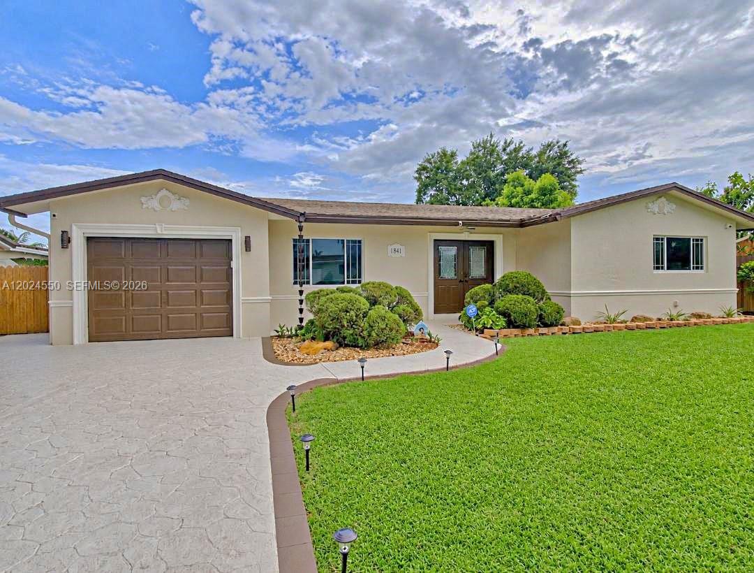 This beautifully maintained Banyan model offers outstanding curb appeal and a long list of upgrades that make it truly move-in ready, some features include: stainless steel appliances, updated windows, French doors, wood laminate flooring, upgraded baseboards, remodeled bathrooms, elegant crown molding, newer A/C (2020) & roof (2019), updated 200-amp electric service, Ring doorbell + 5 security cameras, screened covered porch, hurricane storm panels, private oversized fenced backyard, paver-tiled pool deck, stamped concrete driveway, exterior freshly painted in 2023, you’ll love the convenience of being within walking distance to all schools!